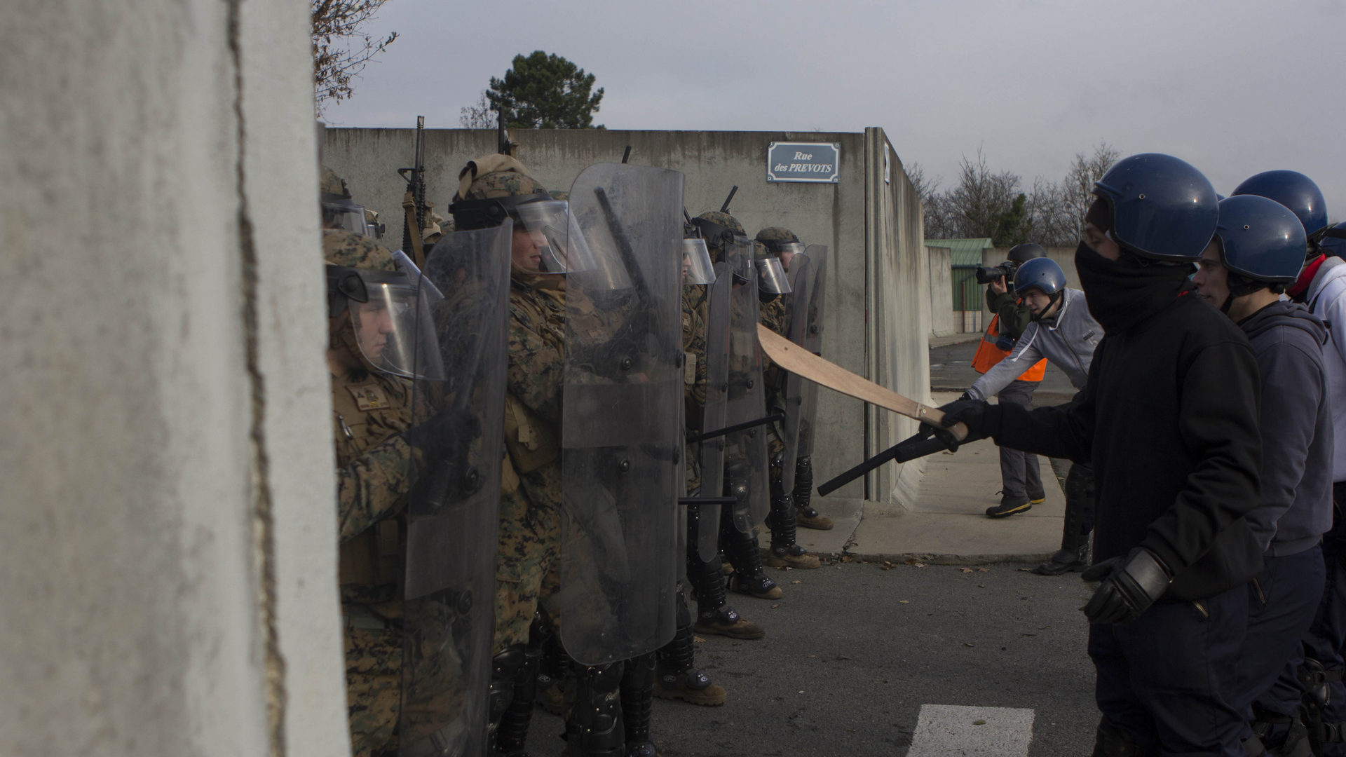 U.S. Marines with SPMAGTF Crisis Response – Africa are taunted by role-playing rioters during crowd and riot control techniques training in St. Astier, France -- USMC Photo © Cpl. Jeraco Jenkins. -