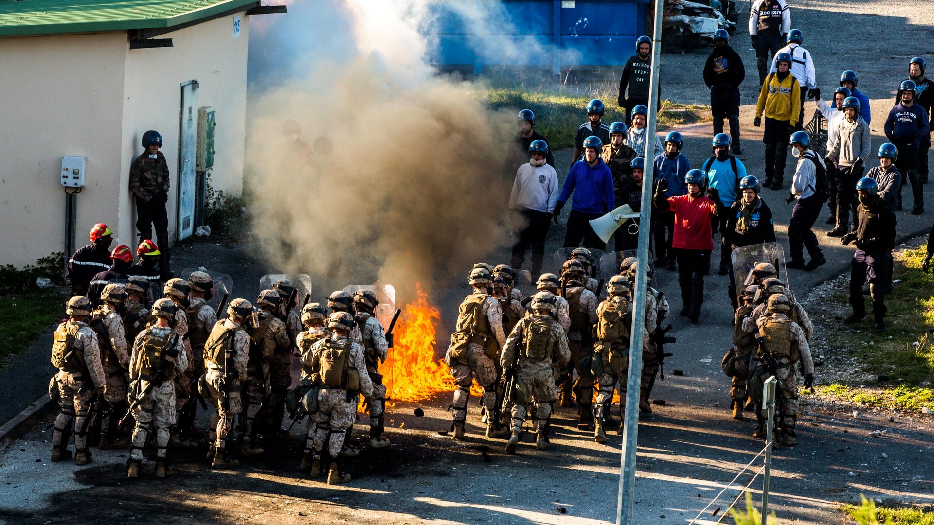 U.S. Marines react to unruly crowds during riot control training at the National Gendarmerie Tactical Training Center in Saint-Astier, France – USMC Photo © Cpl. Jeraco Jenkins. -