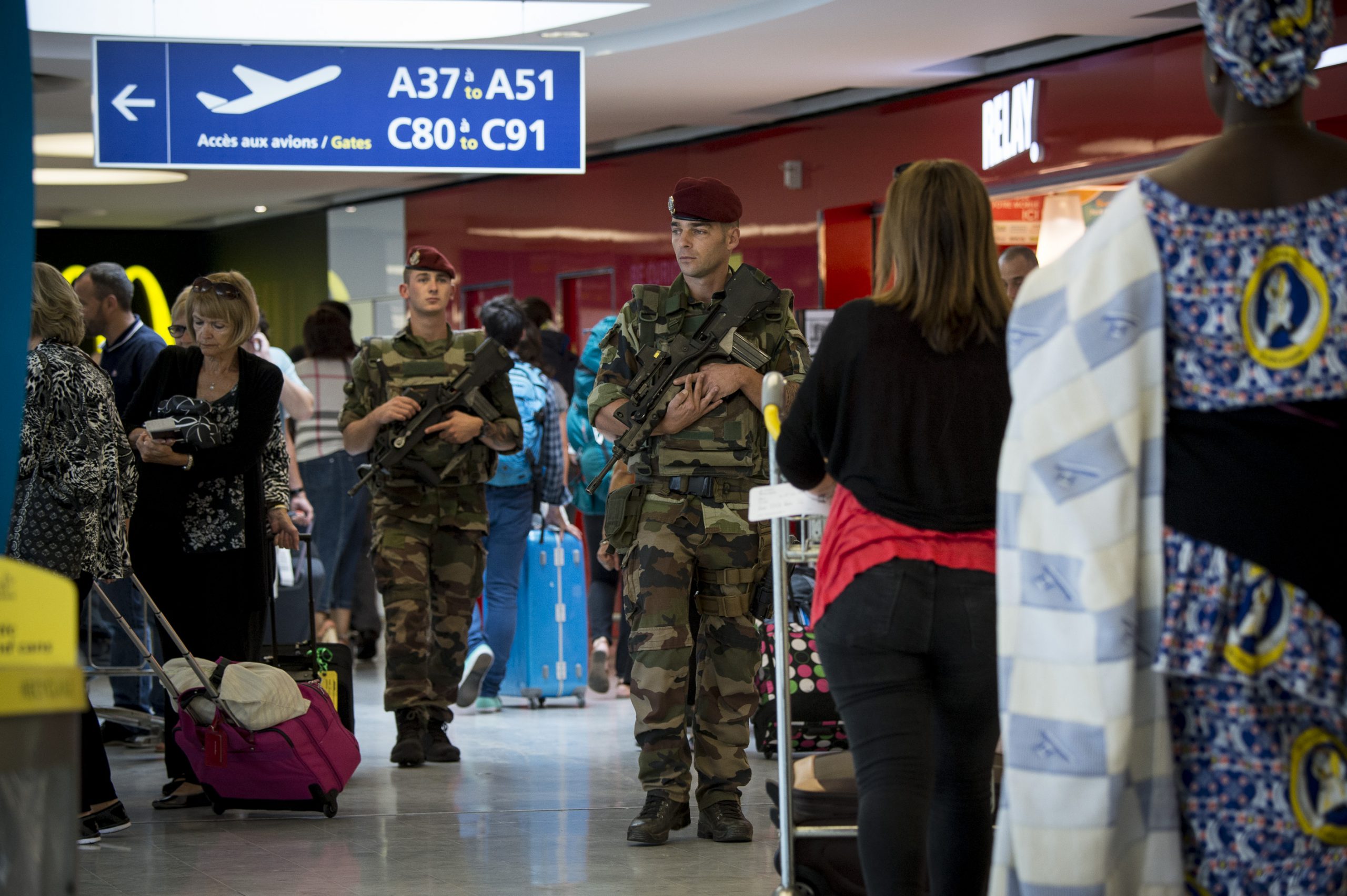 French soldiers provide security at an airport in France as part of Operation Sentinelle. About 13,000 French service members are helping protect France against the threat of extremists. French Ministry of Defense photo. -