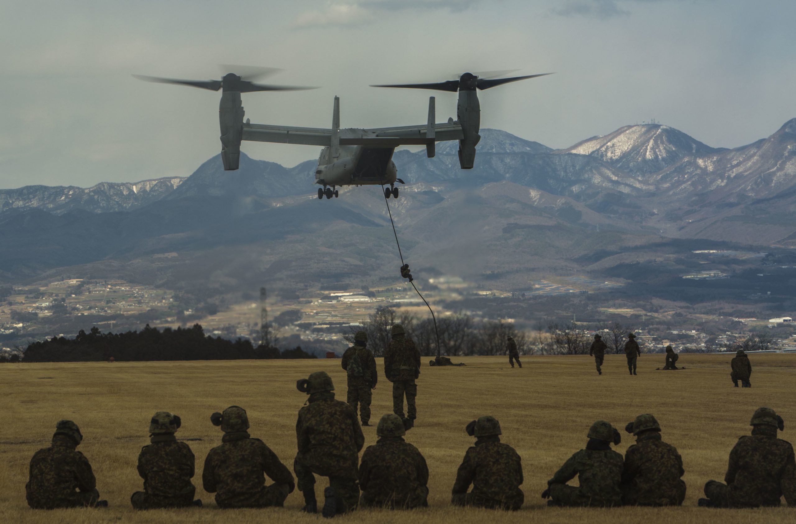 Members of the Japanese Ground Self-Defense Force, 30th Infantry Regiment, 12th Brigade, Eastern Army, fast rope out of an MV-22B Osprey tilt-rotor aircraft during Forest Light 17-1 at Camp Soumagahara, Japan, March 9, 2017. Forest Light is a semi-annual exercise conducted by U.S. and Japanese forces to strengthen interoperability and combined capabilities in defense. Marine Corps photo by Cpl. Kelsey Dornfeld. -