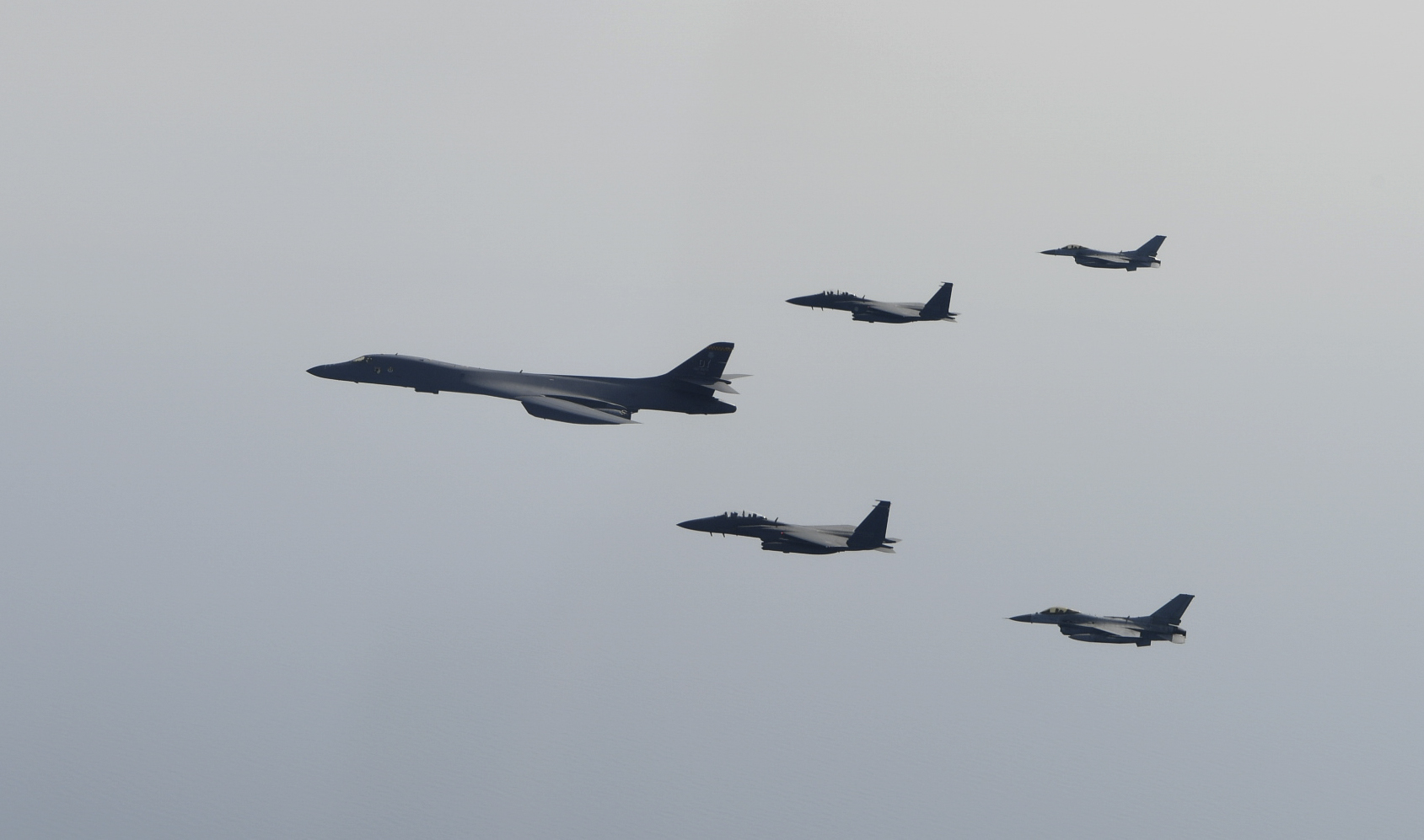 A U.S. Air Force B-1B Lancer flies in formation with Republic of Korea F-15Ks and F-16s in the vicinity of the Republic of Korea March 21, 2017. The sortie was carried out as part of U.S. Pacific Command's continuous bomber presence mission. -