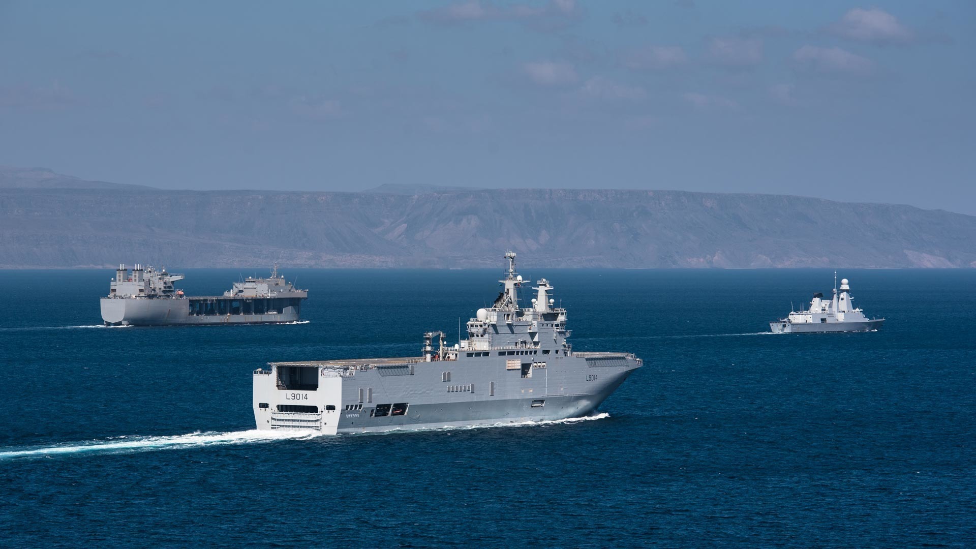 French navy Horizon-class frigate Chevalier Paul (D621) and French navy Mistral-class amphibious assault ship LHD Tonnerre (L9014) line up for a photo with the USS Lewis B. Puller (ESB 3) during Alligator Dagger, a combat rehearsal off the coast of Djibouti -- Photo USMC © MCPO Serge Charmoillaux. -