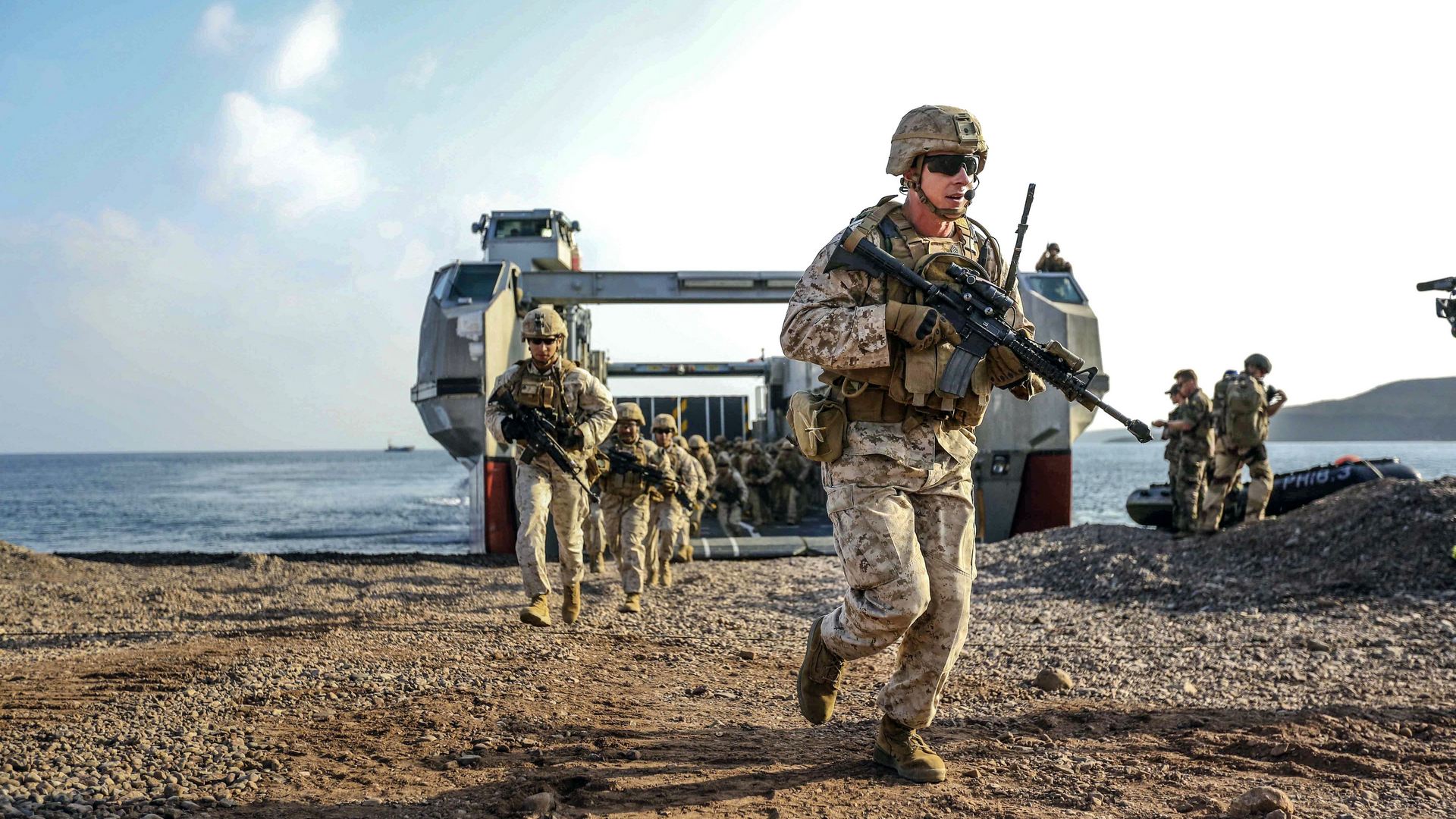 Marine Corps Staff Sgt. Christopher Smith offloads from a French landing craft during a simulated amphibious assault as part of exercise Alligator Dagger, a bilateral combat rehearsal with U.S. and French forces, on Arta Beach, Djibouti -- USMC Photo © Sgt. Jessica Y. Lucio. -