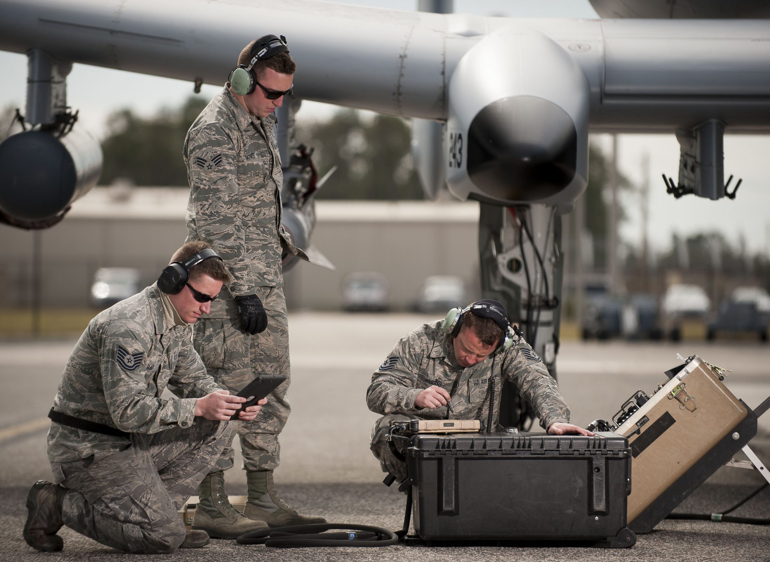 Tech. Sgt. Jack Glad, 122nd Weapons Load, left, Senior Airman Logan Jones, 122nd Avionics, and Tech. Sgt. Mathew Habart, 122nd Avionics, from the 122nd Fighter Wing, Fort Wayne, Ind., upload avionics software to an A-10C Thunderbolt II during Operation Guardian Blitz, Jan. 25, 2018, at MacDill Air Force Base, Fla. Guardian Blitz is a two-week joint exercise to improve service interoperability for combat search and rescue and close air support. U.S. Air National Guard photo by Staff Sgt. William Hopper. -
