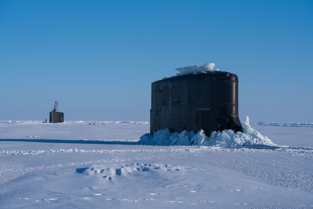 The submarine USS Connecticut and fast-attack submarine USS Hartford breakthrough the ice in support of Ice Exercise 2018 near Ice Camp Skate in the Arctic Circle, March 10, 2018. ICEX 2018 is a five-week exercise that allows the Navy to assess its operational readiness in the Arctic, increase experience in the region, advance understanding of the Arctic environment and continue to develop relationships with other services, allies and partner organizations. Navy photo by Petty Officer 2nd Class Micheal H. Lee -
