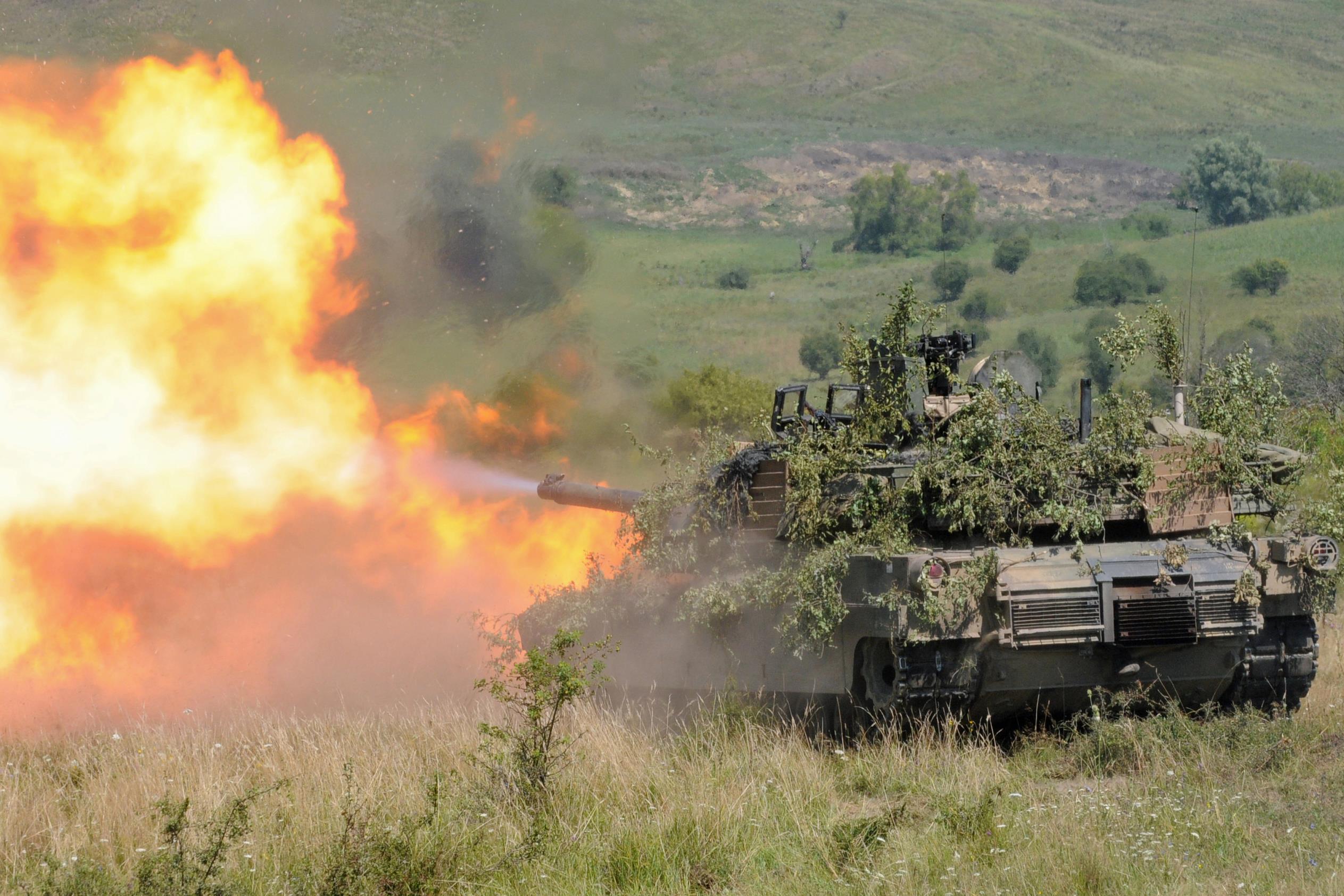 U.S. European Command virtually joined service members around the world conducting a global command-and-control exercise, Austere Challenge 2017, focused on European security. Pictured here, an Abrams tank fires a round during the multinational exercise Saber Guardian 16 near Cincu, Romania, Aug. 6, 2016. The tank belongs to Delta Company, 1st Combined Arms Battalion, 64th Armor Regiment, 1st Armored Brigade Combat Team, 3rd Infantry Division. Approximately 2,800 military personnel from 10 nations took part in Saber Guardian. Army photo by Staff Sgt. Corinna Baltos. -