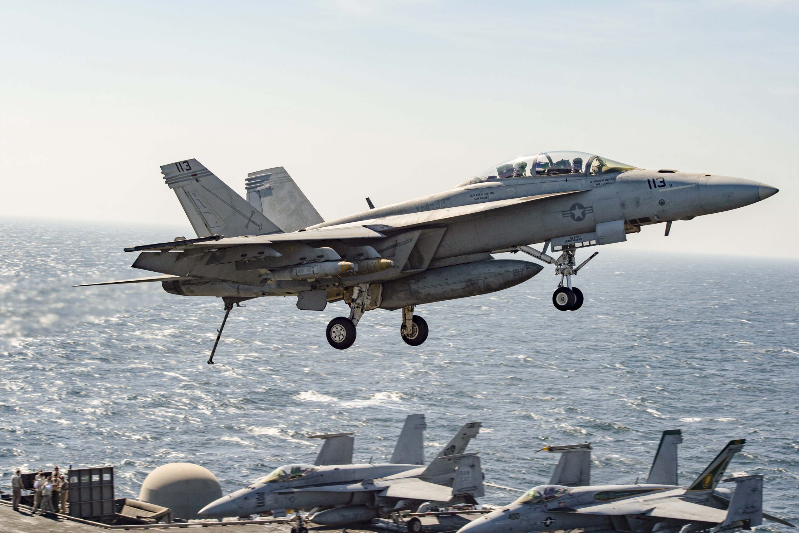 An F/A-18-F Super Hornet assigned to the Fighting Swordsmen of Strike Fighter Squadron 32 flies across the flight deck of the aircraft carrier USS Dwight D. Eisenhower in the Arabian Gulf, Nov. 10, 2016. The Eisenhower and its carrier strike group are deployed in support of Operation Inherent Resolve, maritime security operations and theater security cooperation efforts in the U.S. 5th Fleet area of operations. OIR’s mission to counter the Islamic State of Iraq and the Levant is one of the Defense Department’s five evolving challenges, as discussed in a House Permanent Select Committee on Intelligence hearing with DoD and intelligence officials, Nov. 17, 2016. Navy photo by Petty Officer 3rd Class Nathan T. Beard. -
