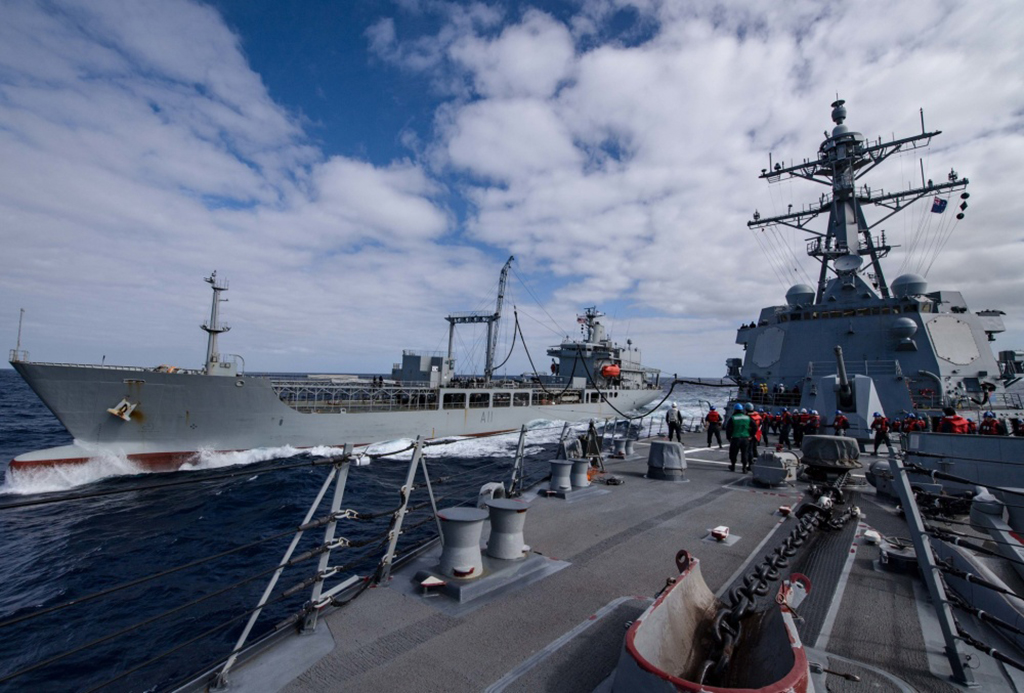 The guided missile destroyer USS Sampson, right, conducts a replenishment-at-sea with fleet oiler HMNZS Endeavour in the western Pacific Ocean, Nov. 13, 2016. The Sampson will assist New Zealand’s authorities in responding to the 7.5 magnitude earthquake that struck Nov. 14, killing two and stranding thousands. Navy photo by Petty Officer 2nd Class Bryan Jackson. -