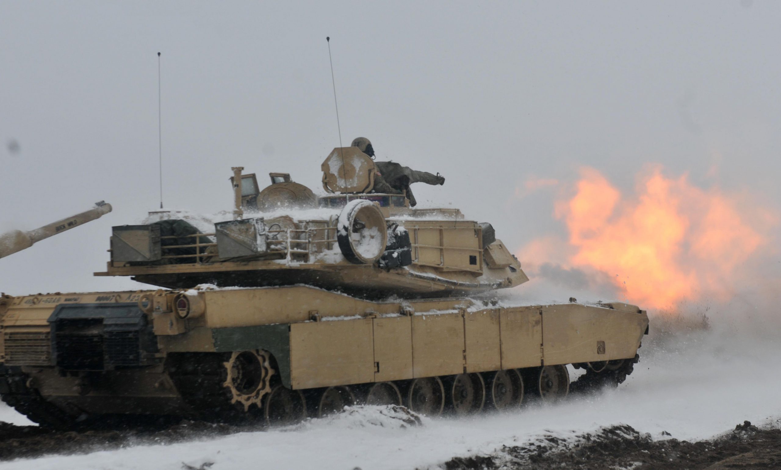A round is fired from a U.S. Army M1A2 tank belonging to 1st Battalion, 68th Armor Regiment, 3rd Armored Brigade Combat Team, 4th Infantry Division, during the first live fire accuracy screening tests at Presidential Range in Swietozow, Poland, Jan. 16, 2017. Army photo by Staff Sgt. Elizabeth Tarr. -
