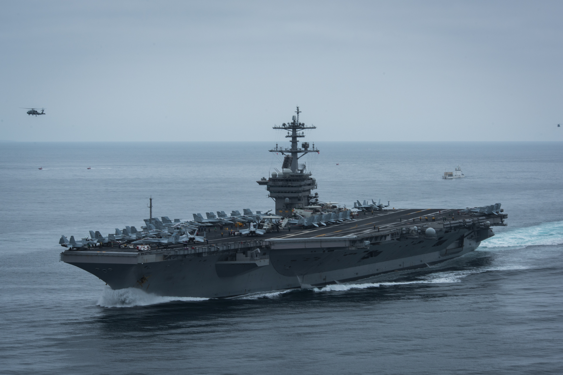 PACIFIC OCEAN (Aug. 6, 2017) The aircraft carrier USS Theodore Roosevelt (CVN 71) participates in a strait transit exercise with ships from its carrier strike group (CSG). Theodore Roosevelt is underway conducting a composite training unit exercise (COMPTUEX) with its CSG in preparation for an upcoming deployment. COMPTUEX tests a carrier strike group's mission-readiness and ability to perform as an integrated unit through simulated real-world scenarios. U.S. Navy photo by Mass Communication Specialist 3rd Class Anthony J. Rivera. -