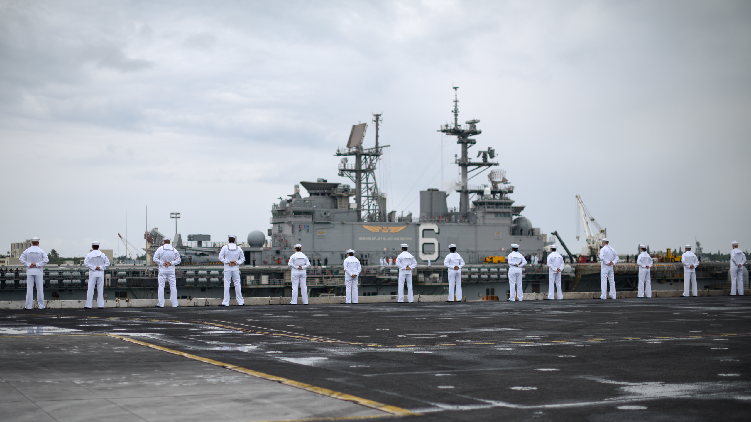 PEARL HARBOR, Hawaii (April 27, 2018) Sailors man the rails of the aircraft carrier USS Theodore Roosevelt (CVN 71) as the ship arrives at Joint Base Pearl Harbor-Hickam for a regularly scheduled port visit. Theodore Roosevelt is underway for a regularly scheduled deployment in the western Pacific. U.S. Navy photo by Mass Communication Specialist Seaman Michael Hogan. -