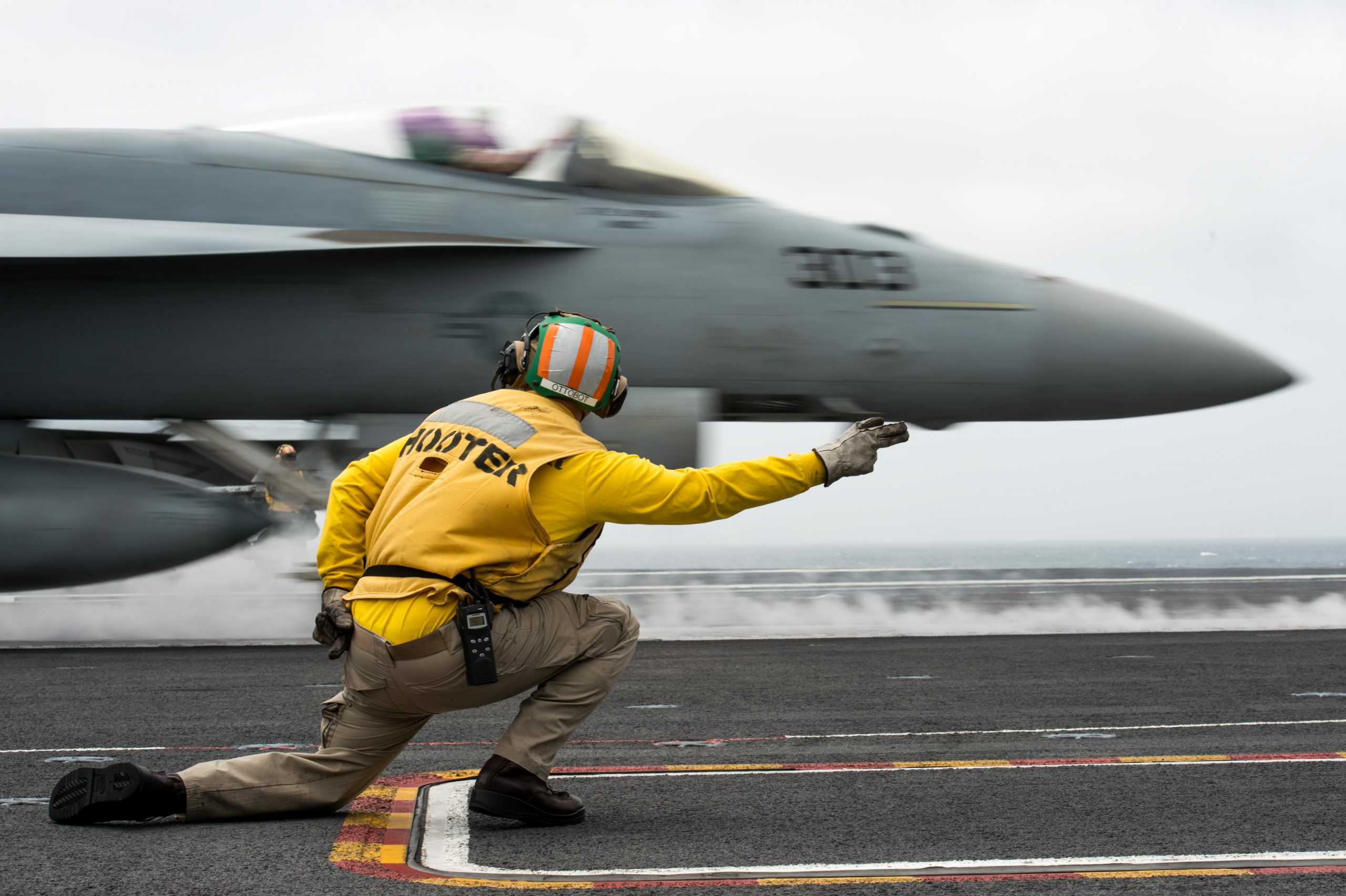 PACIFIC OCEAN (May 10, 2018) Lt. Justin Otto, from Scottsburg, Indiana, gives the signal to launch an F/A-18E Super Hornet, assigned to the "Warhawks" of Strike Fighter Squadron (VFA) 97, on the flight deck of the aircraft carrier USS John C. Stennis (CVN 74). John C. Stennis is underway with the ships and squadrons of Carrier Strike Group (CSG) 3 conducting group sail training in preparation for its next scheduled deployment. U.S. Navy photo by Lt. j.g. Jamie Moroney. -