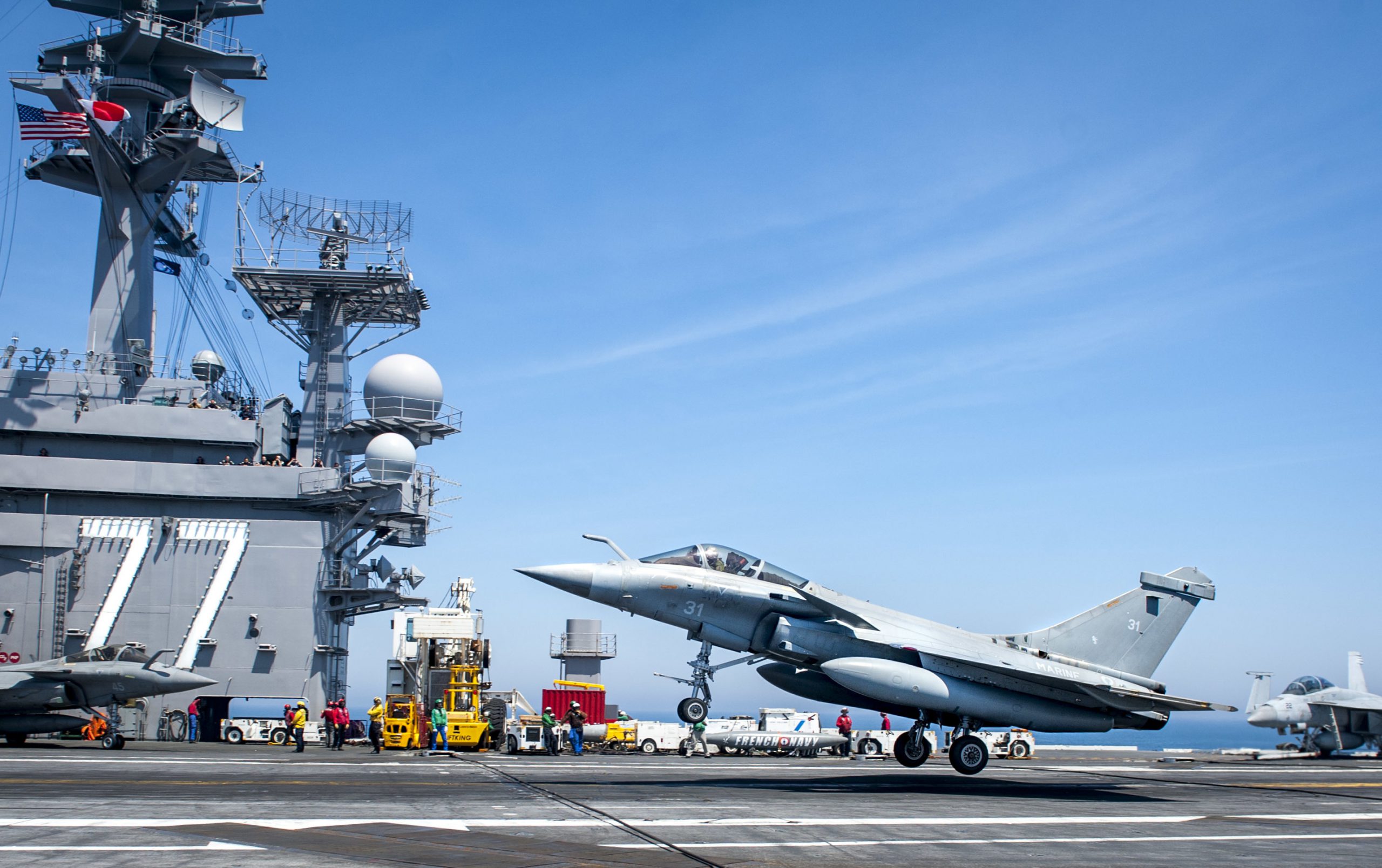 A French navy Rafale aircraft lands on the aircraft carrier USS George H.W. Bush in the Atlantic Ocean, May 11, 2018. The carrier is conducting air wing exercises with the French navy to strengthen partnerships and deepen interoperability between the two nations' naval forces. Navy photo by Petty Officer 3rd Class Brooke Macchietto. -