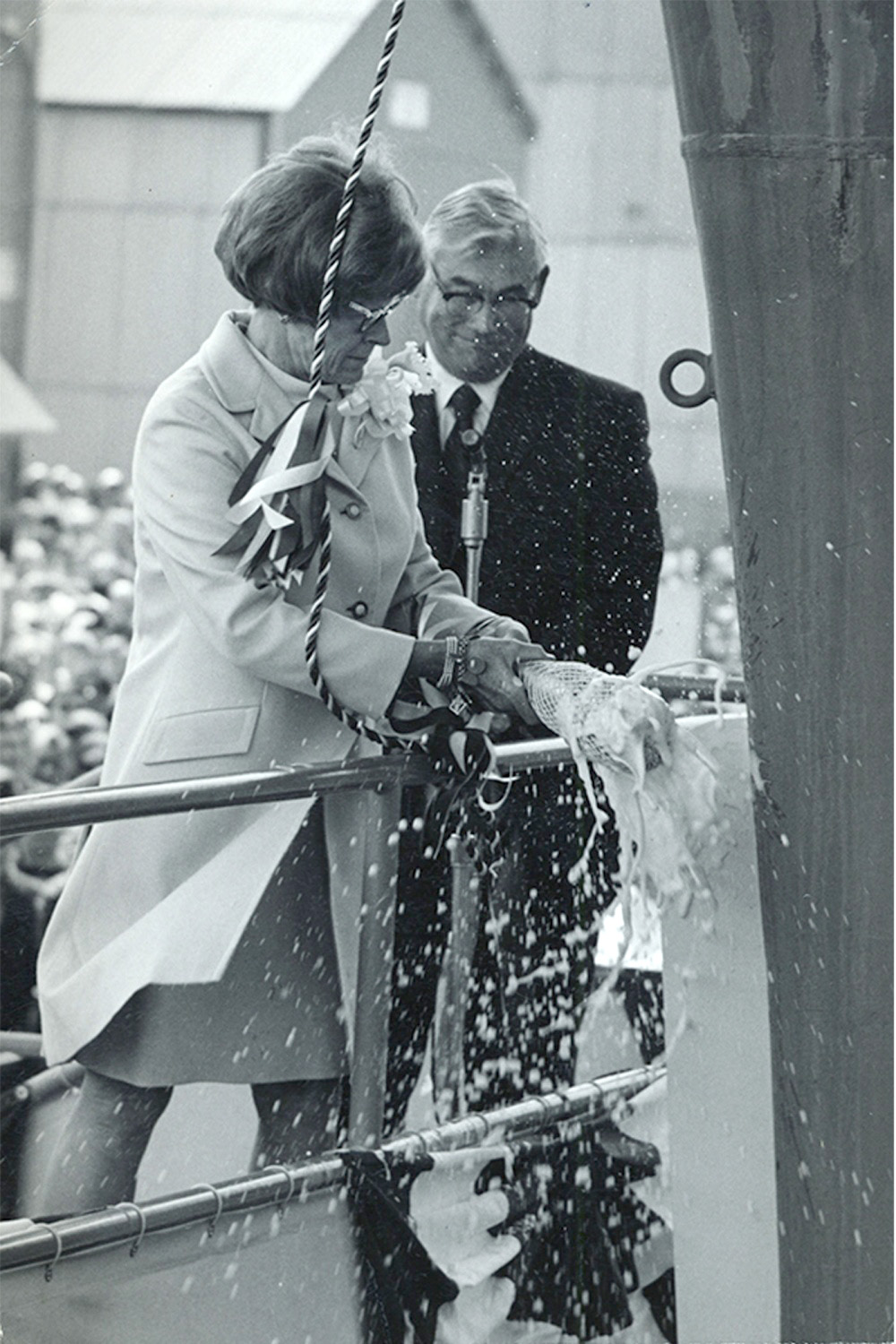 A U.S. navy file photo of Catherine Nimitz Lay, daughter of Fleet Adm. Chester W. Nimitz, breaking a bottle of champagne to christen the aircraft carrier USS Nimitz (CVN 68), May 13, 1972. -