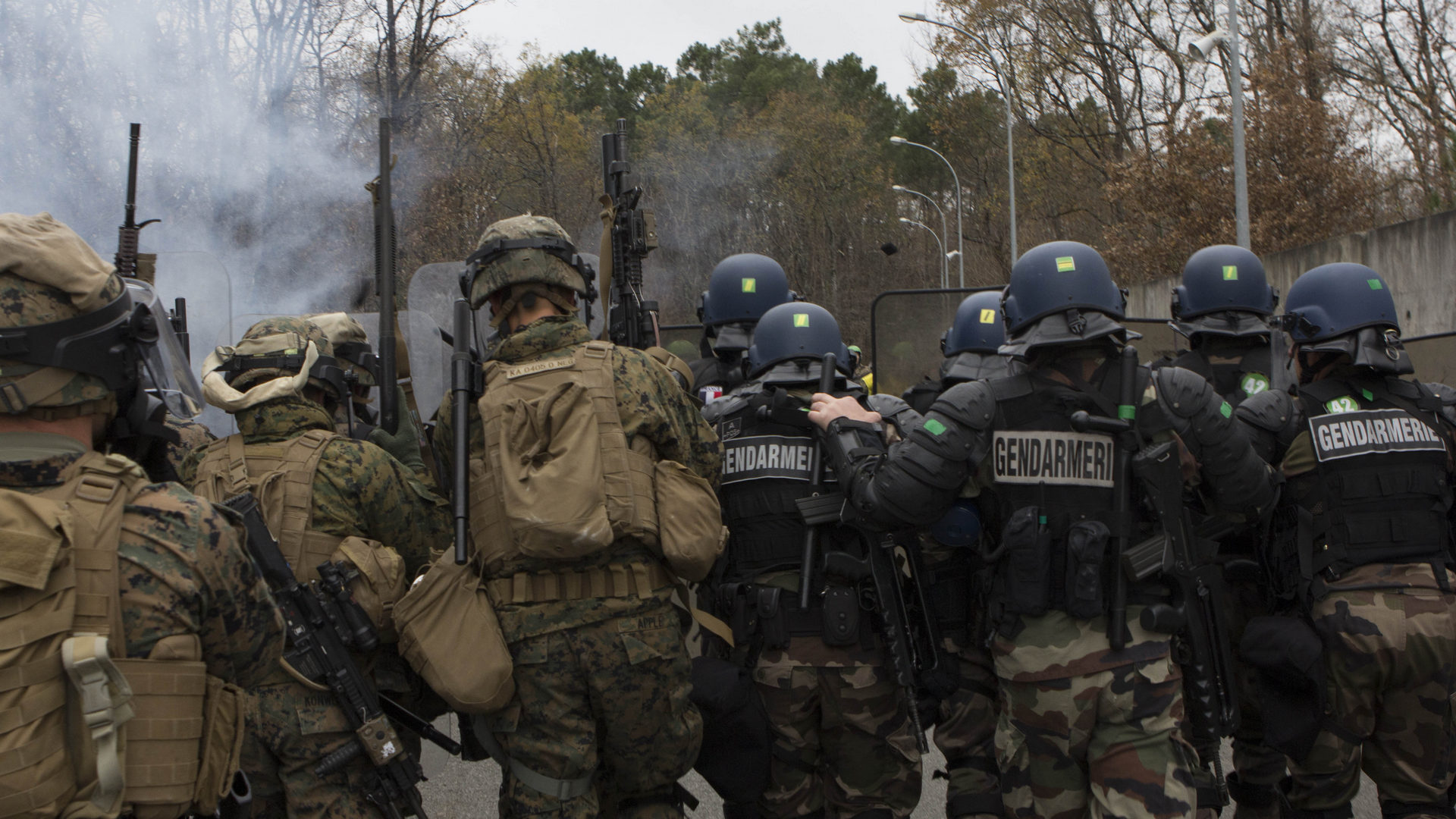 U.S. Marines with SPMAGTF Crisis Response – Africa and Police with Mobile Gendarmeries Armored Group and practice crowd and riot control techniques on National Center for Training of Police Forces of France, St. Astier, France – USMC Photo © Cpl. Jeraco Jenkins. -