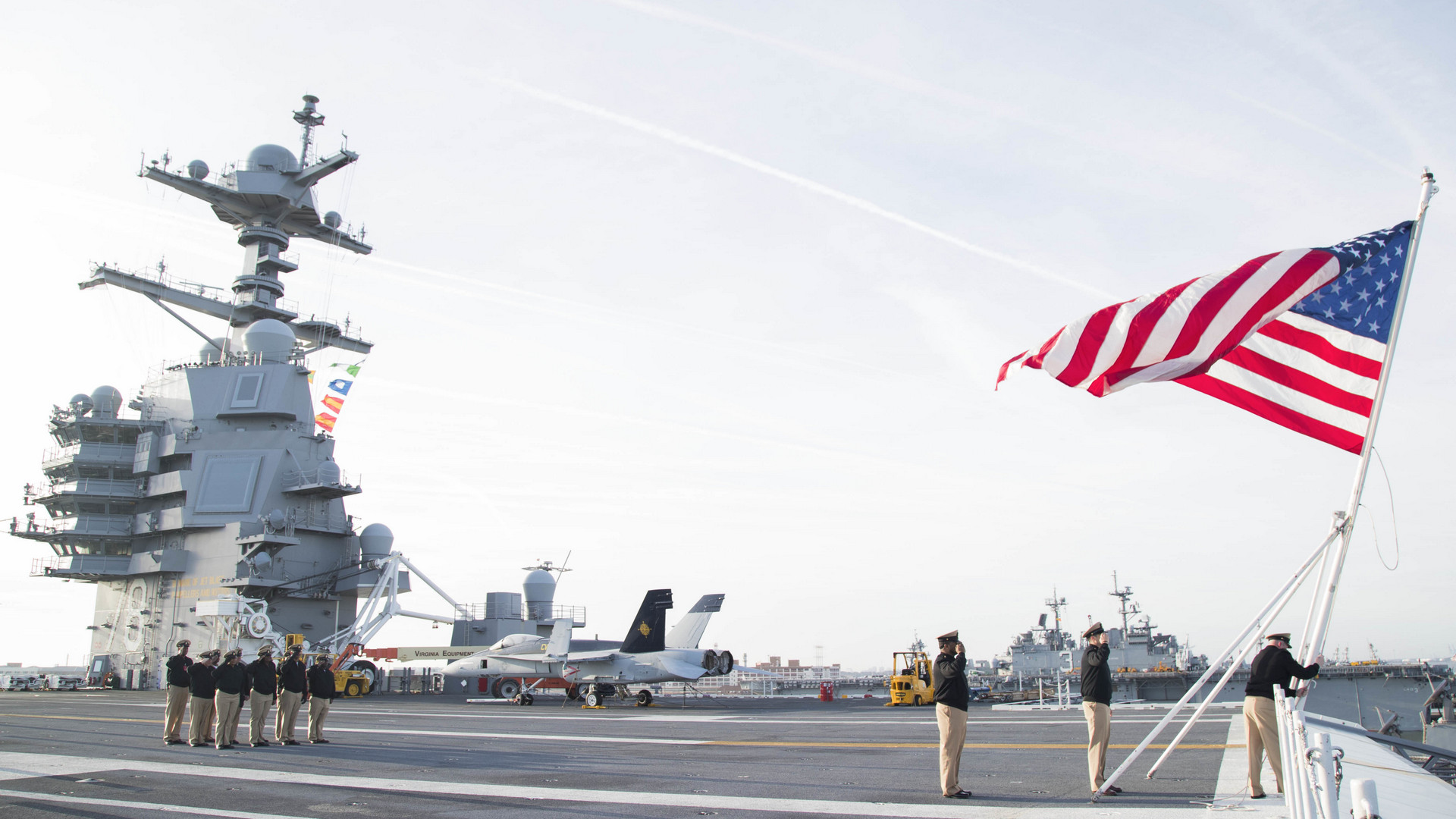 Norfolk (April 1, 2018) Sailors assigned to the aircraft carrier USS Gerald R. Ford's (CVN 78) Chief's Mess conduct colors on the ship's flight deck in commemoration of the 125th anniversary of the chief petty officer rank. (U.S. Navy photo by Mass Communication Specialist 3rd Class Cat Campbell. -