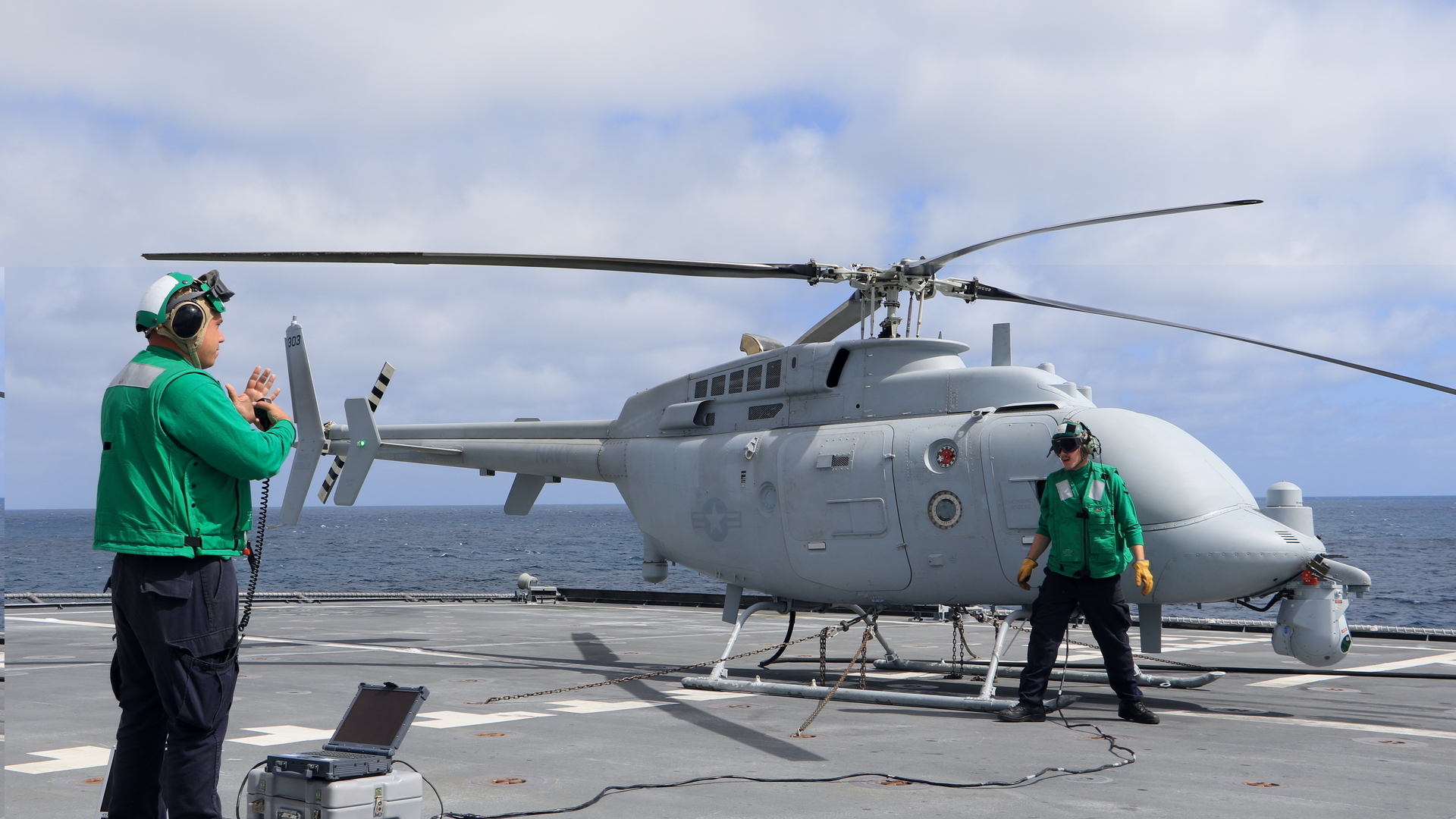 Pacific Ocean (June 21, 2018) Aviation Machinist's Mate 2nd Class Salvatore Green, left, and Aviation Electronics Technician 3rd Class Jake Price, both assigned to Air Test and Evaluation Squadron (VX) 1, prepare the MC-8C Fire Scout unmanned helicopter for launch aboard the littoral combat ship USS Coronado (LCS 4). (U.S. Navy photo by Ensign Jalen Robinson. -