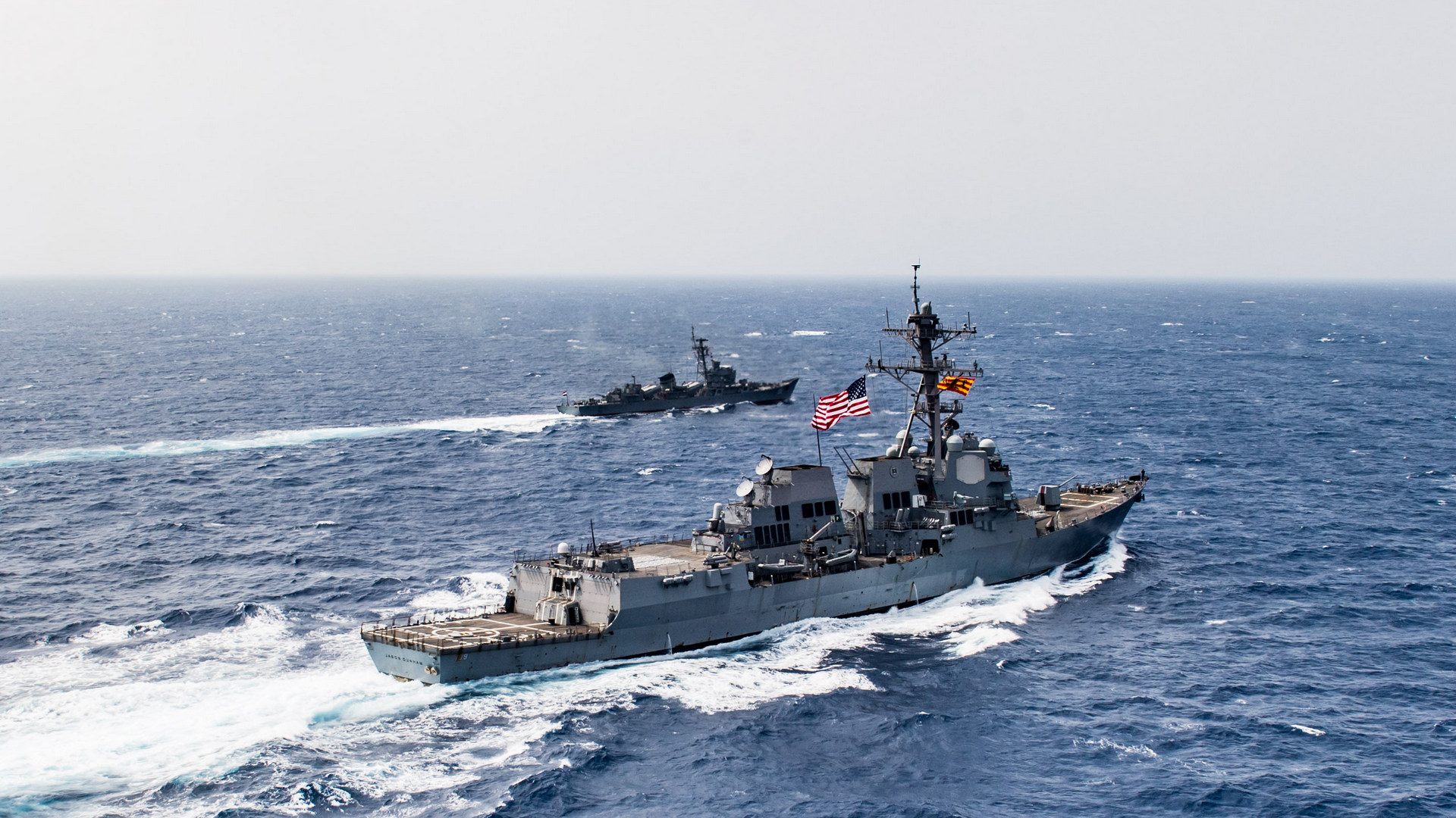 U.S. 5th Fleet Area of Operations : (July 1, 2018) The guided-missile destroyer USS Jason Dunham (DDG 109), bottom-right, conducts a passing exercise with the Egyptian navy frigate El Zafer (F951). Jason Dunham is deployed to the U.S. 5th Fleet area of operations in support of naval operations to ensure maritime stability and security in the Central region, connecting the Mediterranean and the Pacific through the western Indian Ocean and three strategic choke points -- U.S. Navy photo by Mass Communication Specialist 3rd Class Jonathan Clay. -