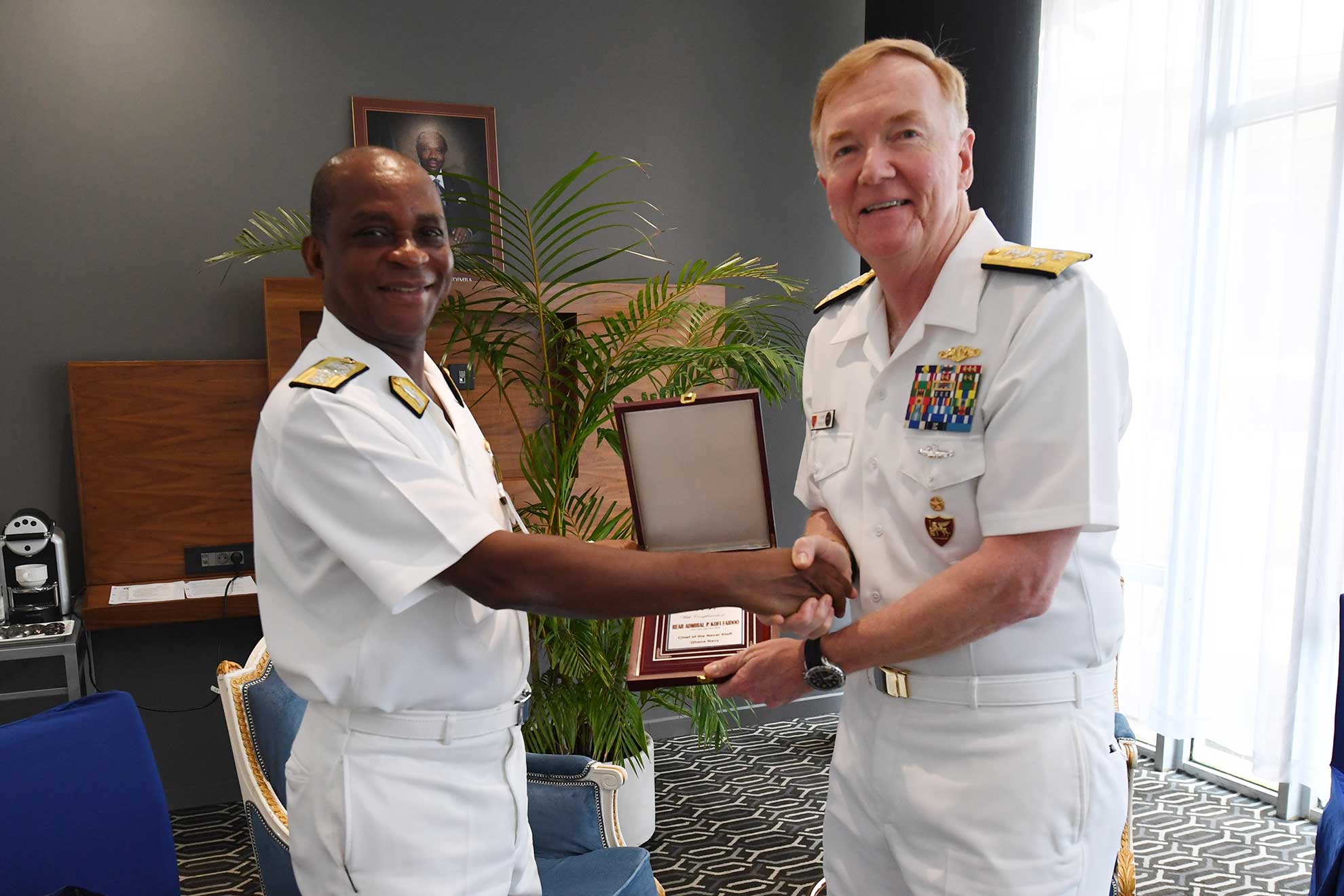 Libreville, Gabon (March 28, 2018) Adm. James G. Foggo III, commander of Naval Forces Europe-Africa and Allied Joint Force Command Naples, exchanges gifts with Ghanain navy Rear Adm. Peter Kofi Faidoo, chief of the naval staff, during exercise Obangame Express 2018 in Libreville, Gabon, March 28. Exercise Obangame Express 2018, which is sponsored by U.S. Africa Command (AFRICOM), is designed to improve regional cooperation, maritime domain awareness (MDA), information-sharing practices, and tactical interdiction expertise to enhance the collective capabilities of Gulf of Guinea and West African nations to counter sea-based illicit activity -- U.S. Navy photo by MCS1 Justin Stumberg. -