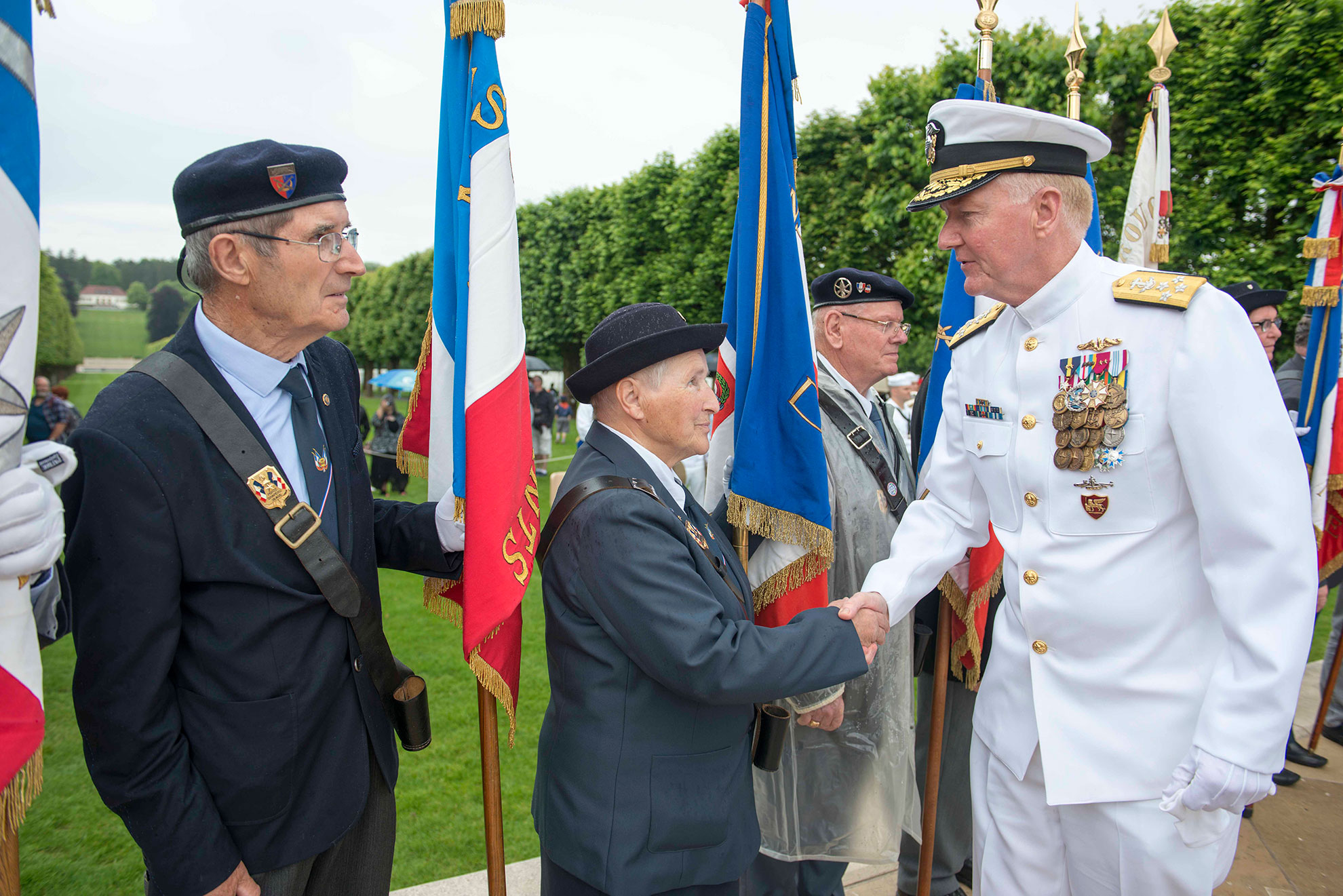Meuse-Argonne, France (May 27, 2018) Adm. James G. Foggo III, commander of U.S. Naval Forces Europe-Africa, thanks veterans for their service following a wreath laying during a Memorial Day and World War I centennial commemoration ceremony at Meuse-Argonne American Cemetery in France. Admirals from U.S. Naval Forces Europe-Africa and U.S. 6th Fleet traveled throughout Europe visiting American cemeteries and monuments to honor the lives and legacies of fallen U.S. and allied service members that paid the ultimate sacrifice in the service of their countries -- U.S. Navy photo by MCS1 Ryan Riley. -