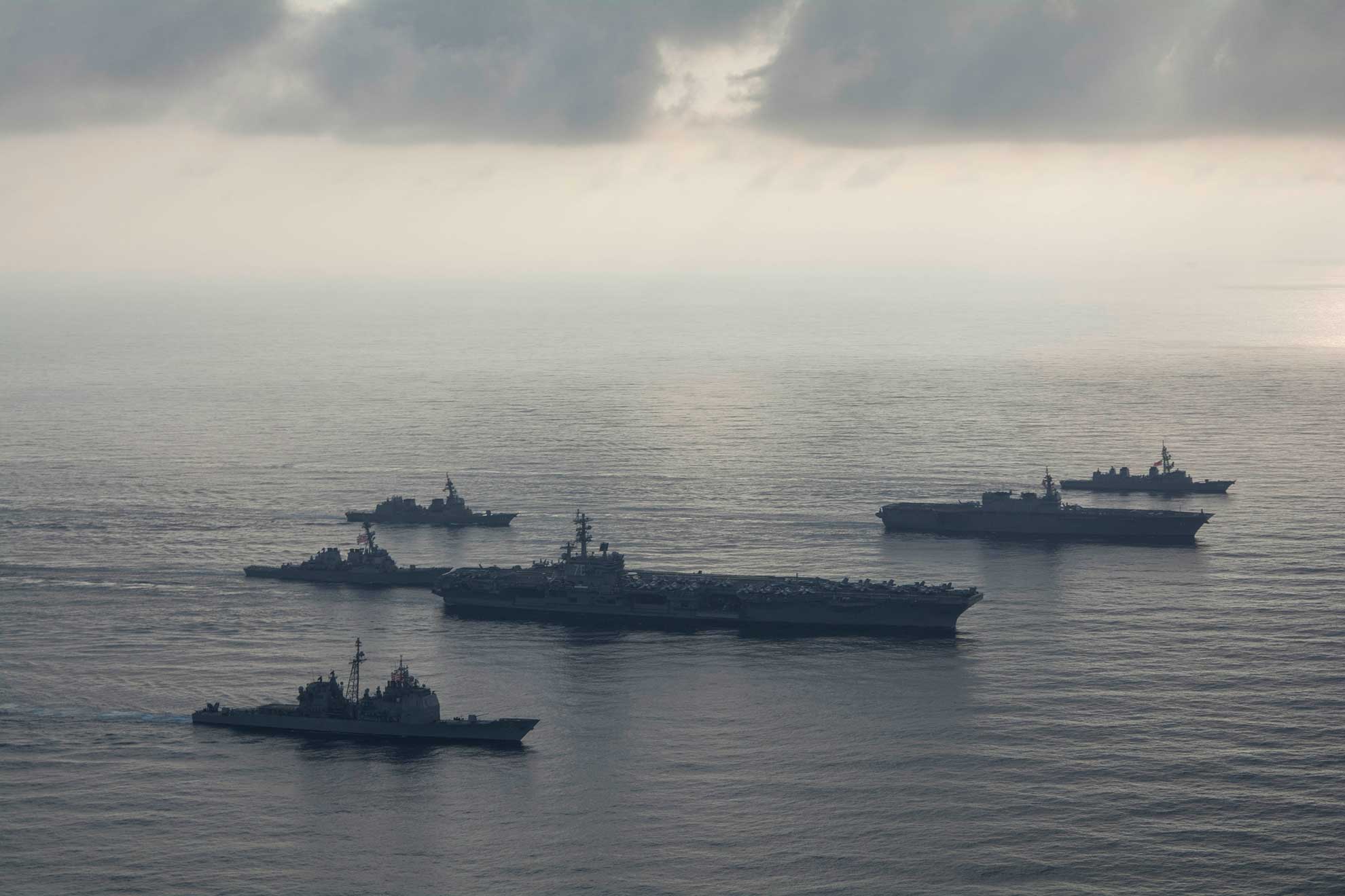 South China Sea (Aug. 31, 2018) The aircraft carrier USS Ronald Reagan (CVN 76), second from bottom, lead ship of the Ronald Reagan Carrier Strike Group, the guided-missile cruiser USS Antietam (CG 54), bottom, and the guided-missile destroyer USS Milius (DDG 69), left, conduct a photo exercise with the Japan Maritime Self-Defense Force (JMSDF) helicopter destroyer JS Kaga (DDH 184), second from top, and the JMSDF destroyers JS Inazuma (DD 105) and JS Suzutsuki (DD 117). The Ronald Reagan Carrier Strike Group is forward-deployed to the U.S. 7th Fleet area of operations in support of security and stability in the Indo-Pacific region.-- U.S. Navy photo by MC S3 Erwin Jacob Villavicencio Miciano. -