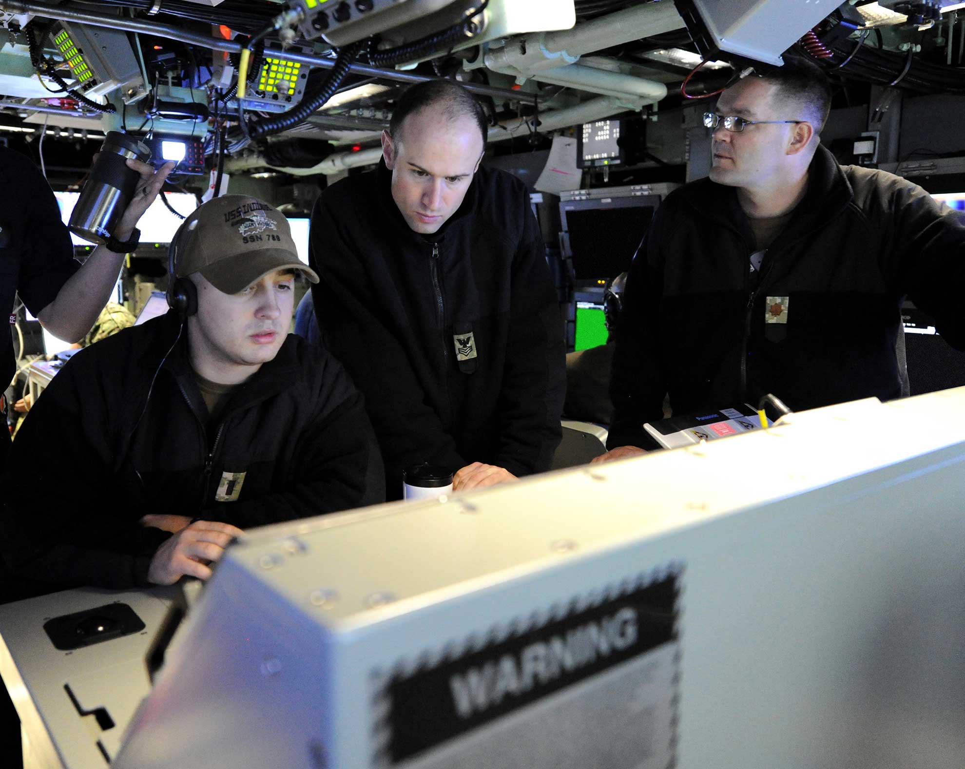 Atlantic Ocean (June 24, 2018) Sailors assigned to the Virginia-class fast attack submarine Pre-Commissioning Unit (PCU) Indiana (SSN 789) stand watch in the control room while underway. Indiana is the 16th Virginia-class fast attack submarine and is scheduled to be commissioned Sept. 29, 2018 -- U.S. Navy photo by Chief MCS Darryl Wood. -