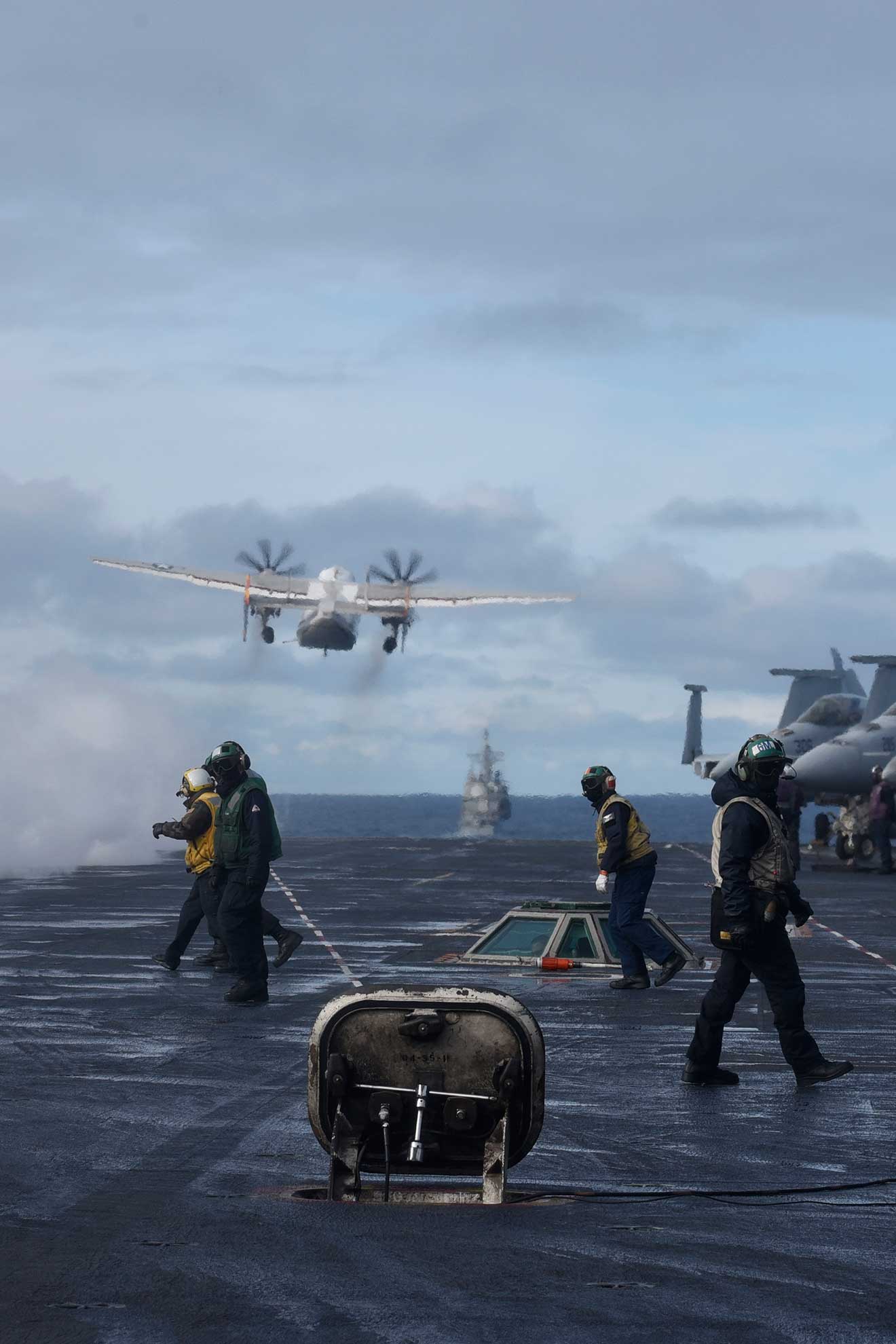 North Atlantic (Sept. 18, 2018) Sailors stand on the flight deck after launching a C-2A Greyhound assigned to the "Rawhides" of Fleet Logistics Support Squadron (VRC) 40 aboard the Nimitz-class aircraft carrier USS Harry S. Truman (CVN 75) in the North Atlantic, Sept. 18, 2018. The Harry S. Truman Carrier Strike Group is deployed to the U.S. 6th Fleet area of operations, demonstrating commitment to regional allies and partners, combat power, and flexibility of U.S. naval forces to operate wherever and whenever the nation requires -- U.S. Navy photo by MCS2 Anthony Flynn. -