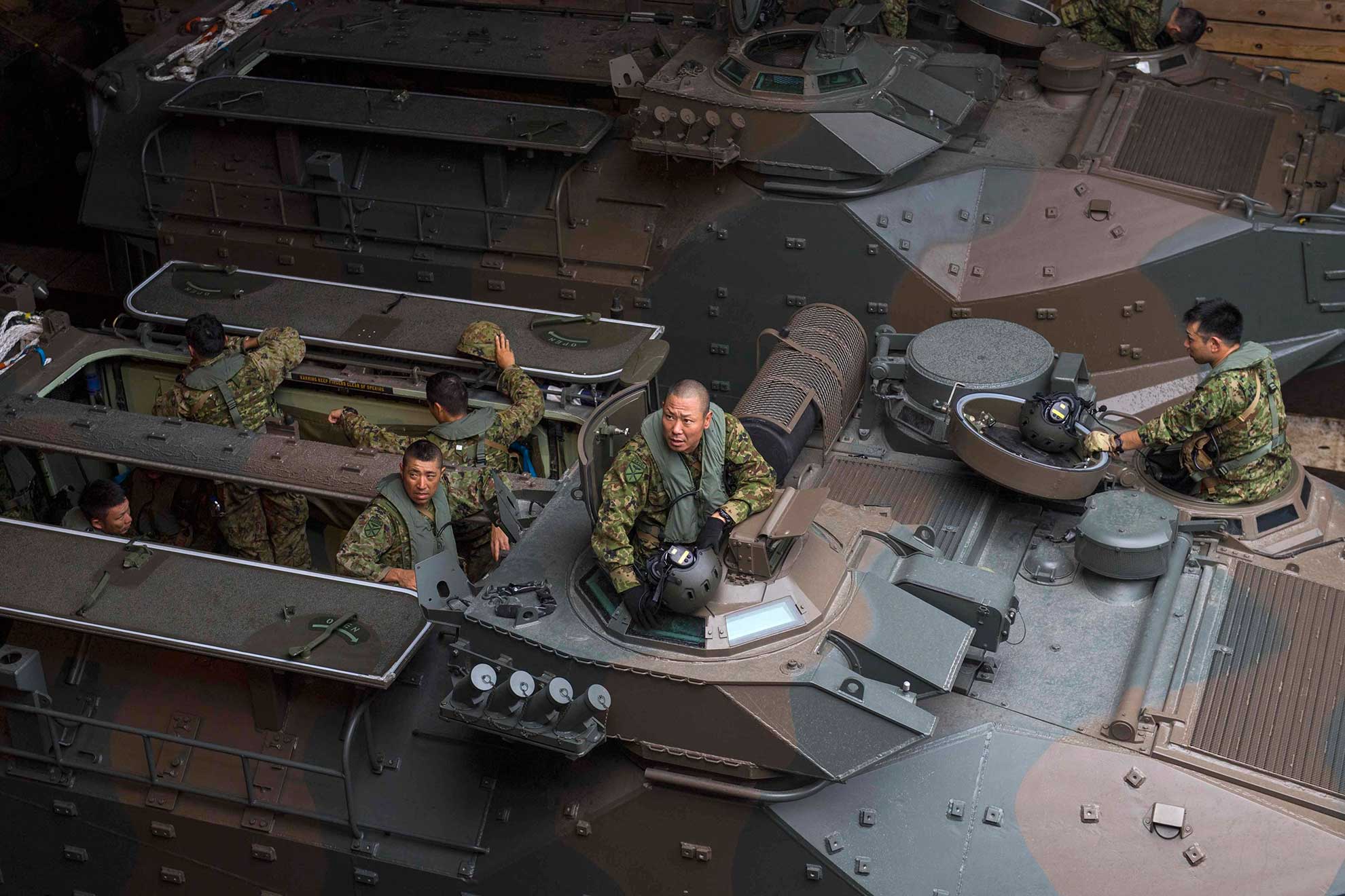 Subic bay, Republic of the Philippines (Oct. 2, 2018) Marines from the Japan Ground Self-Defense Force (JGSDF) Amphibious Rapid Deployment Brigade (ARDB) stand by inside the well deck of the amphibious dock landing ship USS Ashland (LSD 48). Ashland, part of the Wasp Amphibious Ready Group U.S. Navy photo by MCS Joshua Mortensen. -