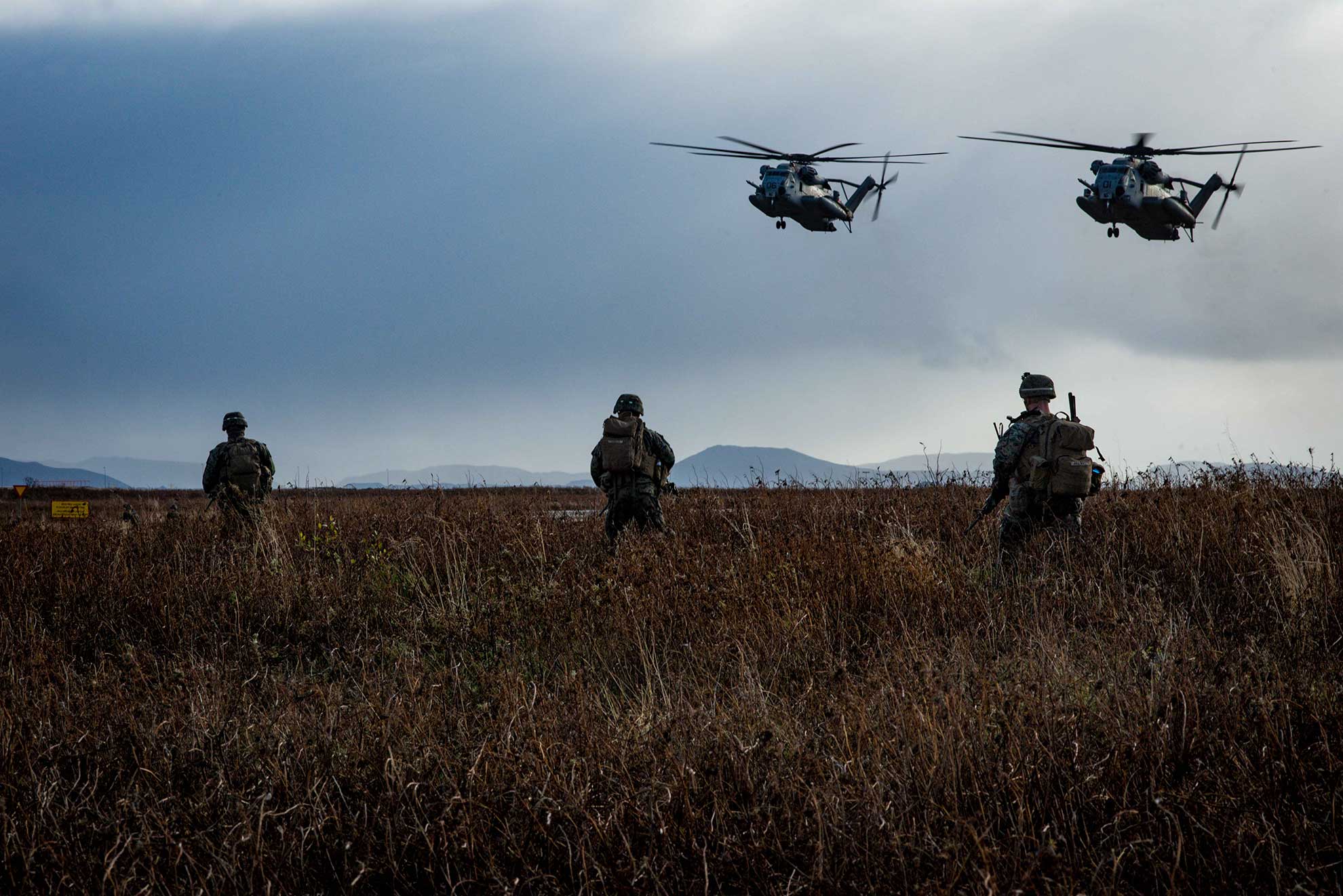Keflavik, Iceland (Oct. 17, 2018) CH-53 Super Stallion helicopters, assigned to the 24th Marine Expeditionary Unit, prepare to retrieve U.S. Marines during a simulated air assault as part of exercise Trident Juncture 2018 in Keflavik, Iceland, Oct. 17, 2018. Trident Juncture, a NATO-led exercise, hosted by Norway, will include around 50,000 personnel from NATO countries, as well as Finland and Sweden, and will test NATO's collective response to an armed attack against one ally, invoking Article 5 of the North Atlantic Treaty -- U.S. Navy photo by MCS2 Jonathan Nelson -