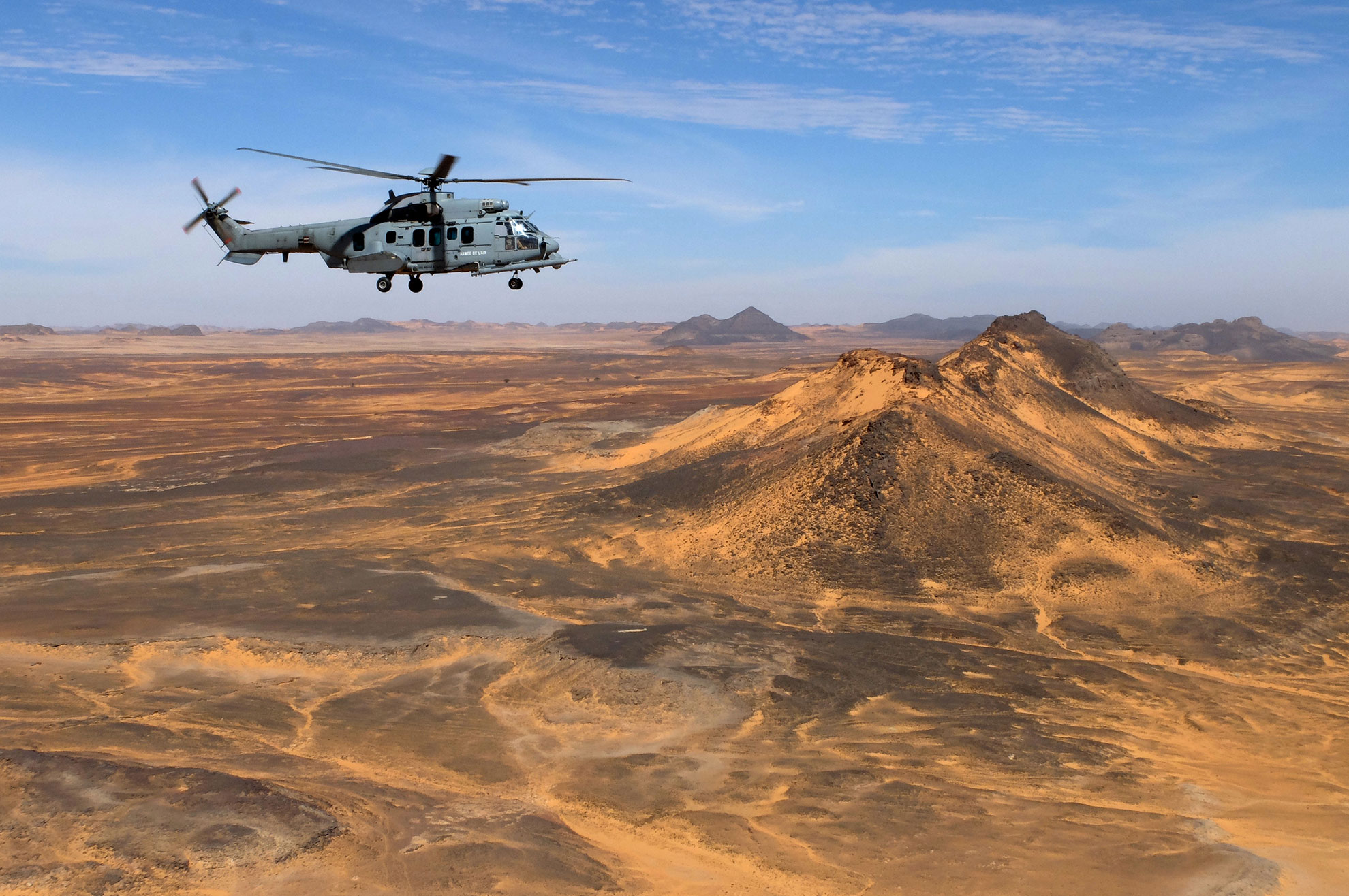 Caracal flying over African desert -- French Air Force © photo. -