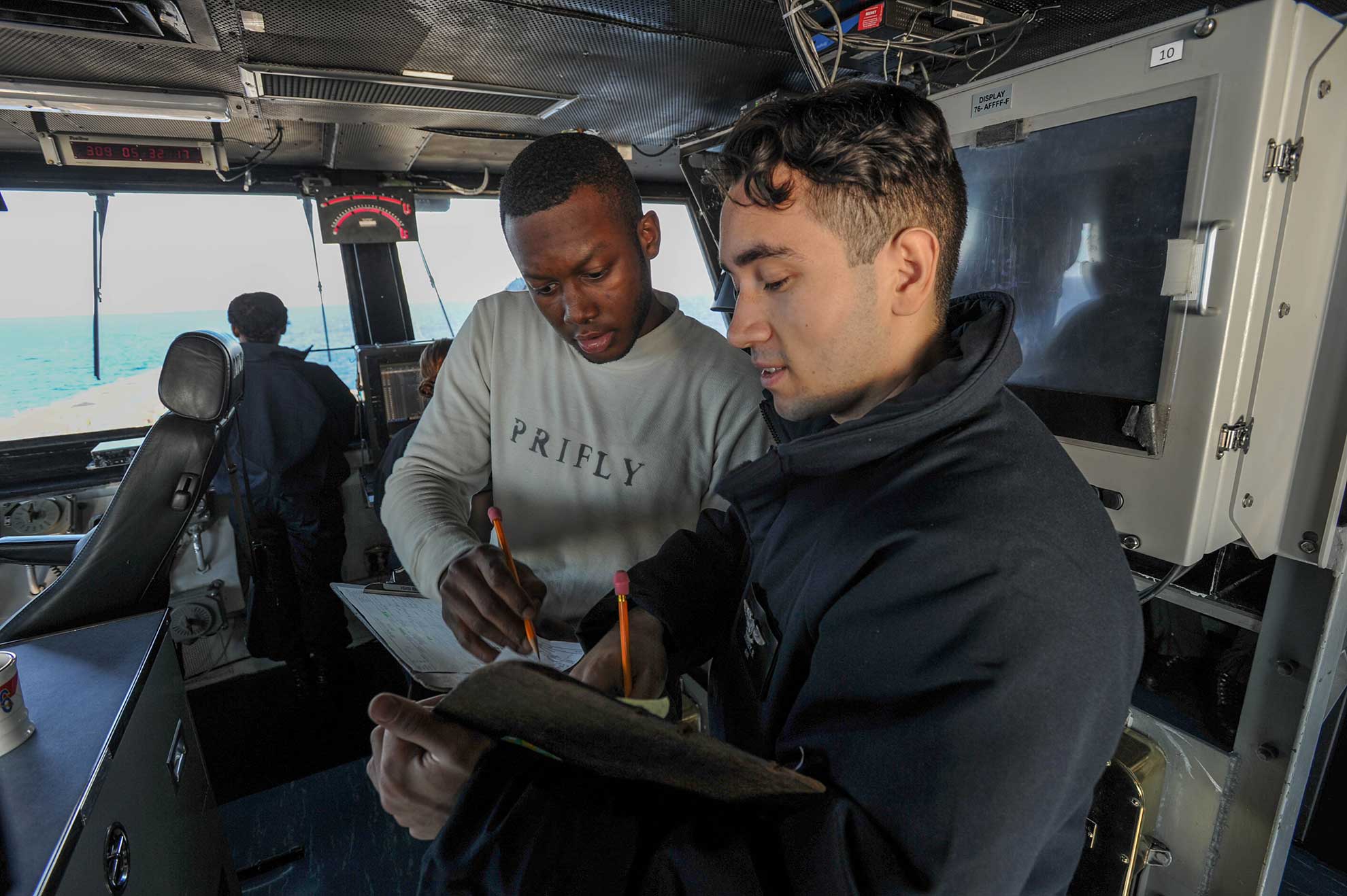 Philippine Sea (Nov. 5, 2018) Sailors update flight schedule trackers aboard the Navy's forward-deployed aircraft carrier USS Ronald Reagan (CVN 76) during exercise Keen Sword 19. Keen Sword is a joint, bilateral field-training exercise involving U.S. military and Japan Maritime Self-Defense Force personnel, designed to increase combat readiness and interoperability of the Japan-U.S. alliance -- U.S. Navy photo by MCS3 Kyleigh Williams. -
