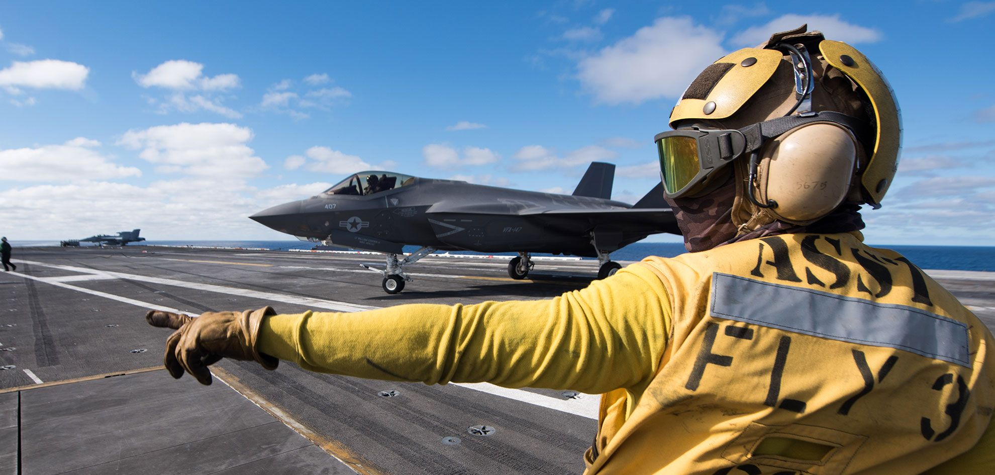 Pacific Ocean (Dec. 8, 2018) Aviation Boatswain's Mate (Handling) 3rd Class Christian Cottman directs an F-35C Lightning II assigned to the "Argonauts" of Strike Fighter Squadron (VFA) 147 on the flight deck of Nimitz-class aircraft carrier USS Carl Vinson (CVN 70) -- U.S. Navy photo by MCS3 Ethan J. Soto. -