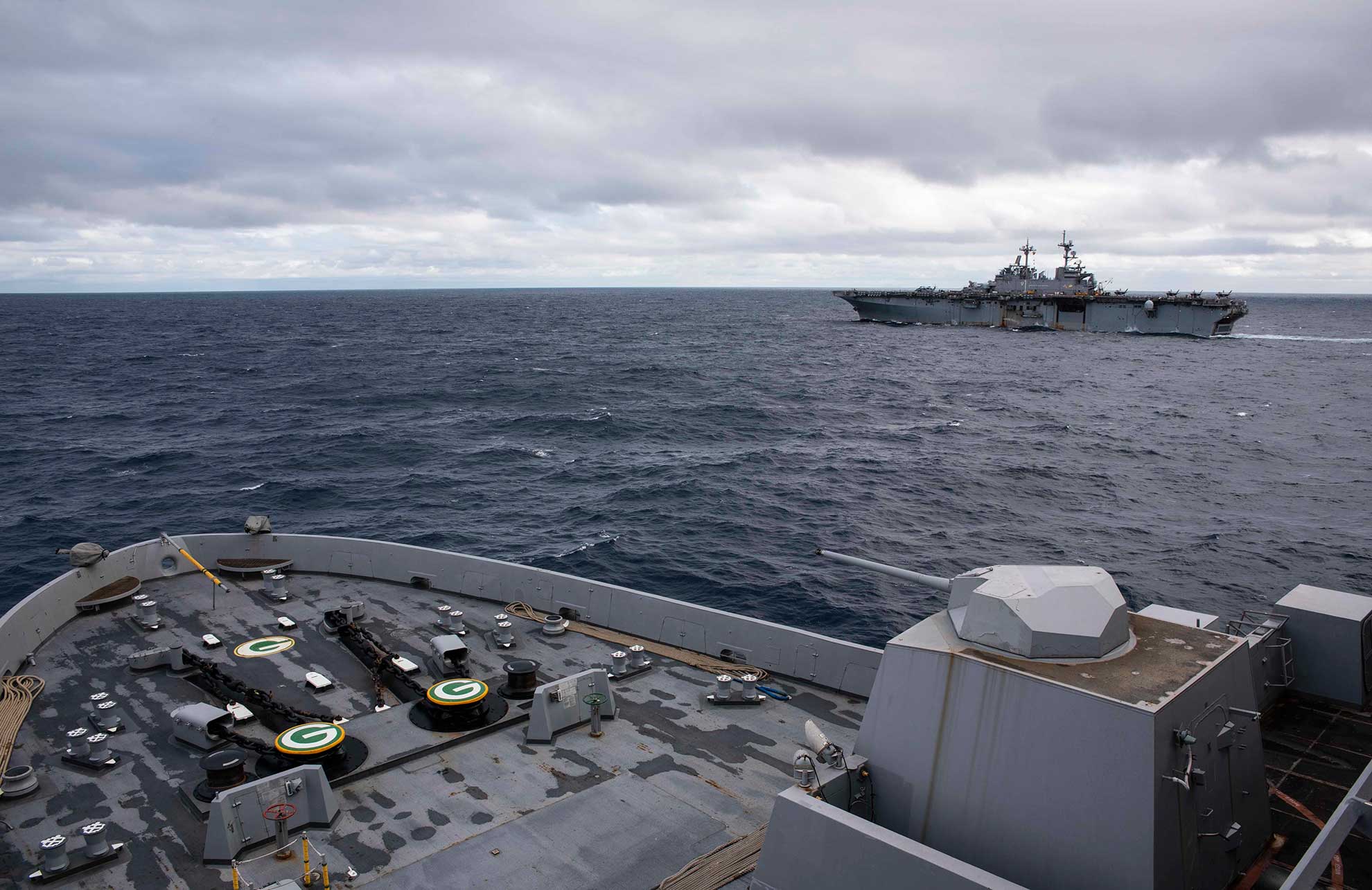 East China sea (Jan. 12, 2019) The amphibious assault ship USS Wasp (LHD 1) transits the East China Sea with the amphibious transport dock ship USS Green Bay (LPD 20), foreground, during a cooperative deployment with the Japan Maritime Self-Defense Force amphibious transport dock ship JS Kunisaki (LST 4003), not pictured. The amphibious transport dock ship USS Green Bay (LPD 20), part of the Wasp Amphibious Ready Group, is operating in the region to enhance interoperability with partners and serve as a ready-response force for any type of contingency -- U.S. Navy photo by MCS Anaid Banuelos Rodriguez. -