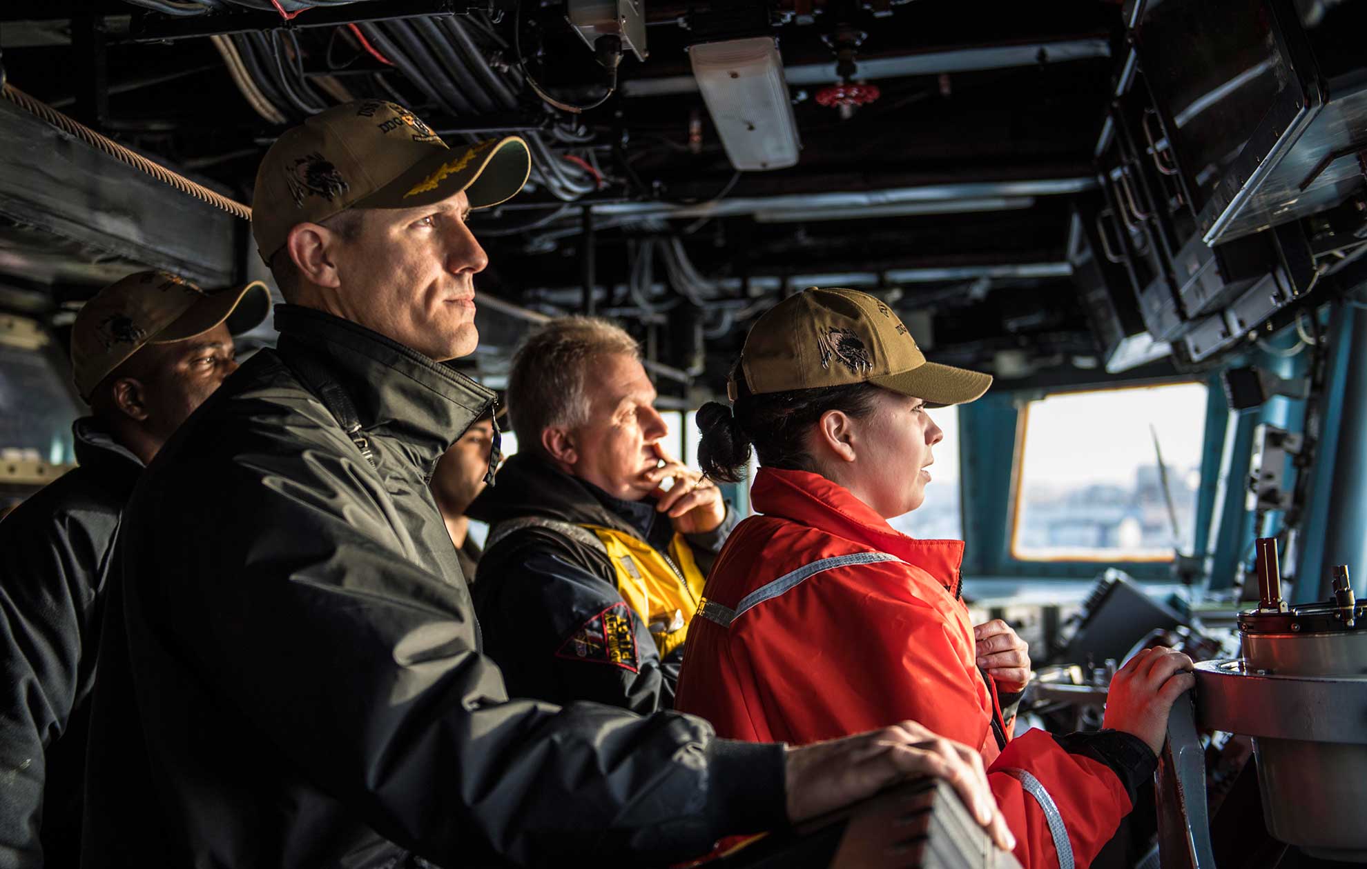 Plymouth, England (Feb. 11, 2019) Cmdr. Craig Trent, left, commanding officer of the Arleigh Burke-class guided-missile destroyer USS Porter (DDG 78), observes from the bridge as the ship departs Plymouth, England, Feb. 11, 2019. Porter, forward-deployed to Rota, Spain, is on its sixth patrol in the U.S. 6th Fleet area of operations in support of U.S national security interests in Europe and Africa -- U.S. Navy photo by MCS2 James R. Turner. -