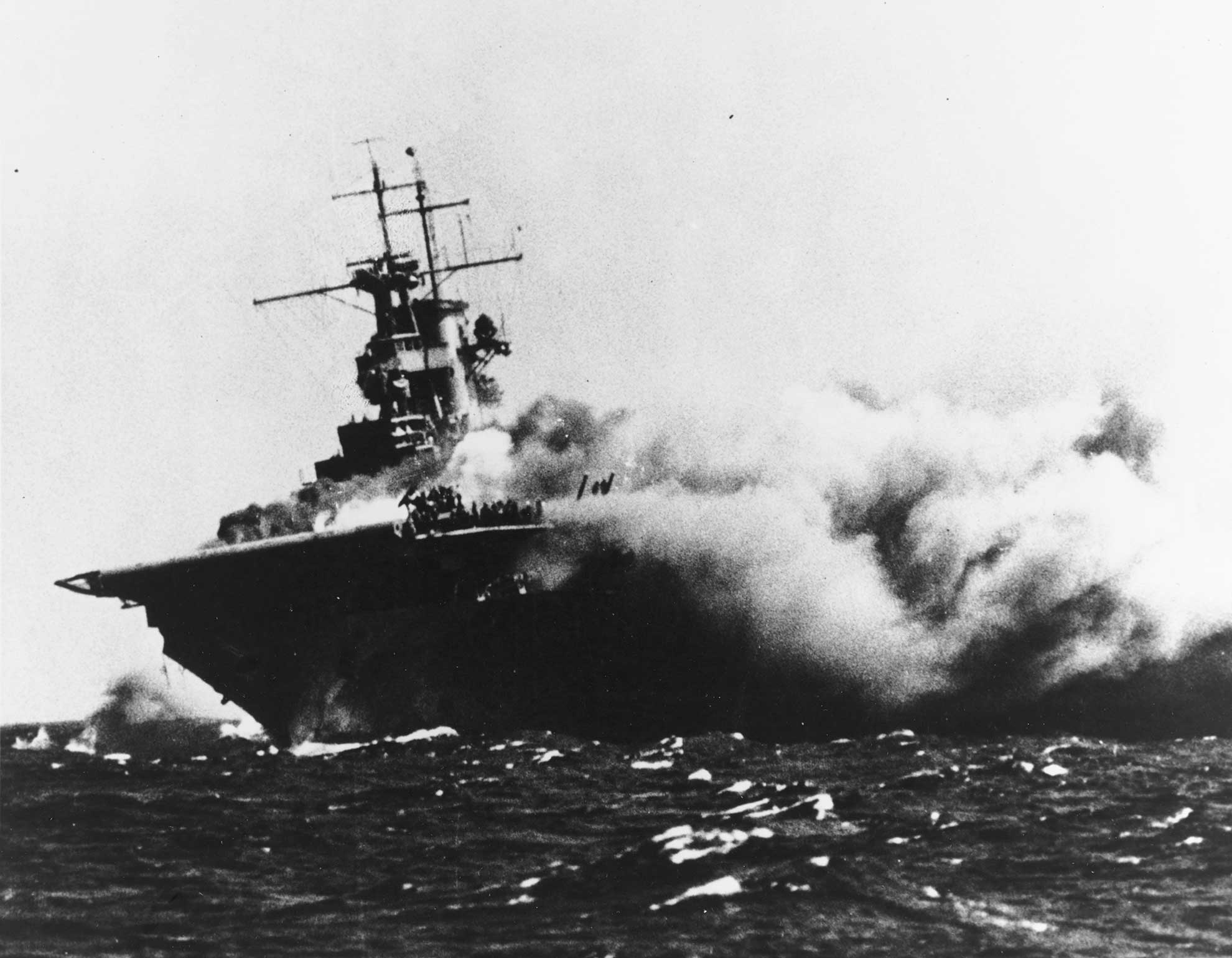 Wshington D.C. (March 14, 2019) The aircraft carrier USS Wasp (CV-7) is shown burning and listing after it was torpedoed by the Japanese navy submarine I-19 on Sept. 15, 1942 while operating in the Southwestern Pacific in support of forces on Guadalcanal -- U.S. Navy photo courtesy of the National Archives. -