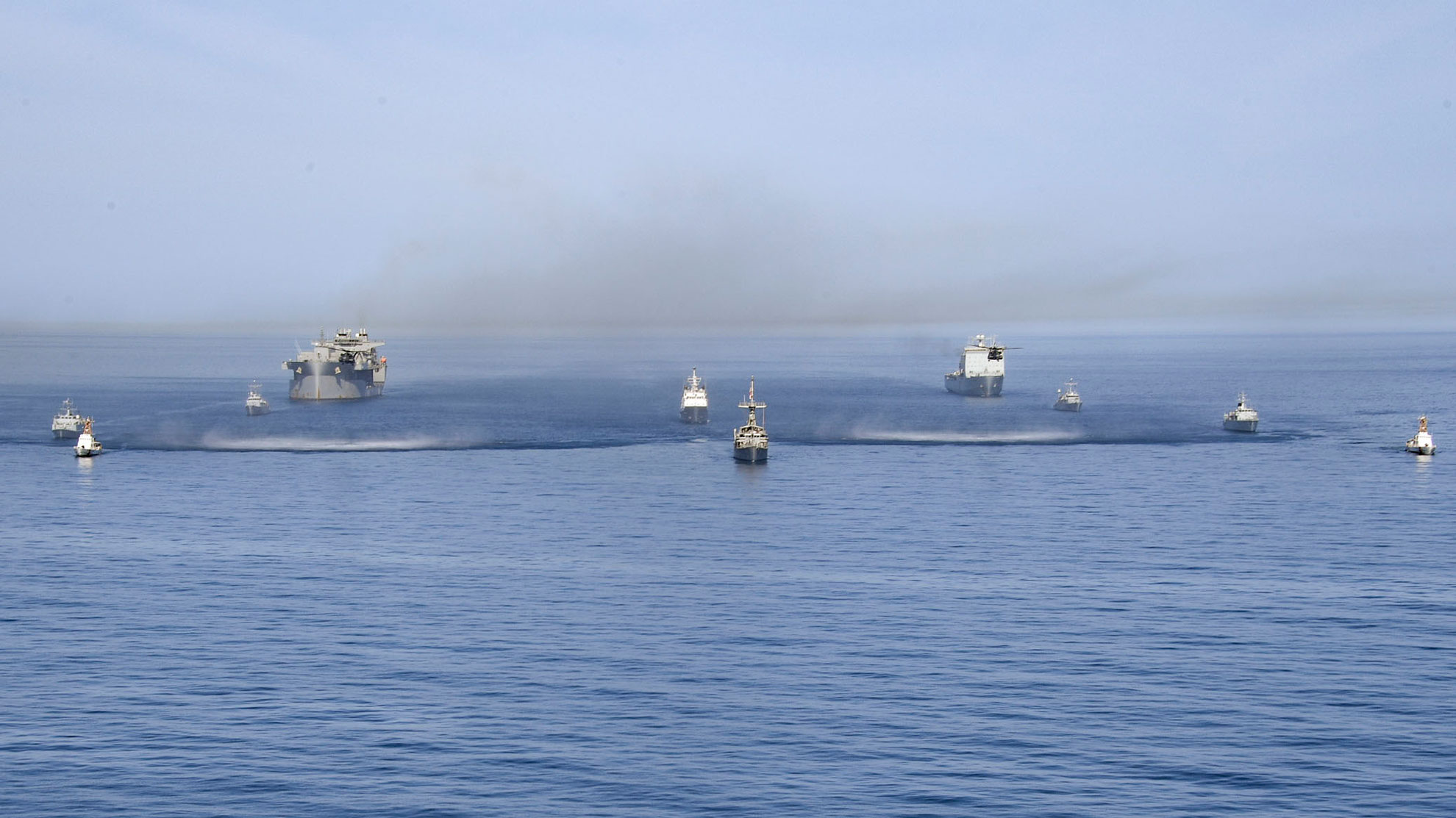 Arabian Gulf (April 10, 2019) The U.S. Navy expeditionary sea base USS Lewis B. Puller (ESB 3), fleet ocean tug USNS Catawba (T-ATF 168), Avenger-class mine countermeasures ship USS Sentry (MCM 3), U.S. Coast Guard Island-class coastal patrol boats USCGC Maui (WPB 1304) and USCGC Wrangell (WPB 1332); the United Kingdom Royal Navy's RFA Cardigan Bay (L3009); the French Marine Nationale's minehunters FS L'Aigle (M647) and FS Sagittaire (M650); the United Kingdom Royal Navy's minehunters HMS Shoreham (M112) and HMS Ledbury (M30); and Mine Countermeasures Squadron (HM-15) MH-53E Sea Dragon helicopters navigate the Arabian Gulf in formation during Artemis Trident 19. Artemis Trident is a mine countermeasures exercise conducted by France's Marine Nationale, the United Kingdom's Royal Navy and the U.S. Navy in the Arabian Gulf focused on increasing interoperability and demonstrating the nations' shared commitment to ensuring unfettered maritime operations -- U.S. Navy photo by MCS 2nd Class -