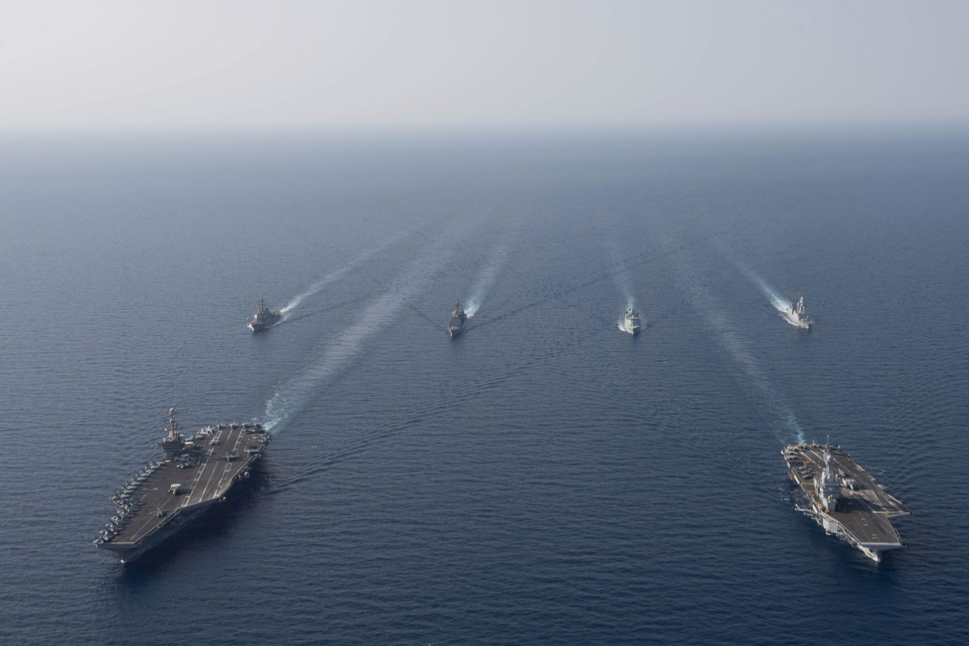 Red Sea (April 15, 2019) The aircraft carrier USS John C. Stennis (CVN 74), front left, the French Marine Nationale aircraft carrier FS Charles de Gaulle (F 91), front right, the guided-missile destroyer USS McFaul (DDG 74), the guided-missile cruiser USS Mobile Bay (CG 53), the Royal Danish Navy frigate HDMS Niels Juel (F 363) and the French F70AA-class air defense destroyer FS Forbin (D 620) are underway in formation in the Red Sea, April 15, 2019. The John C. Stennis Carrier Strike Group is deployed to the U.S. 5th Fleet area of operations in support of naval operations to ensure maritime stability and security in the Central Region, connecting the Mediterranean and the Pacific through the western Indian Ocean and three strategic choke points. (U.S. Navy photo by Mass Communication Specialist Seaman Joshua L. Leonard. -