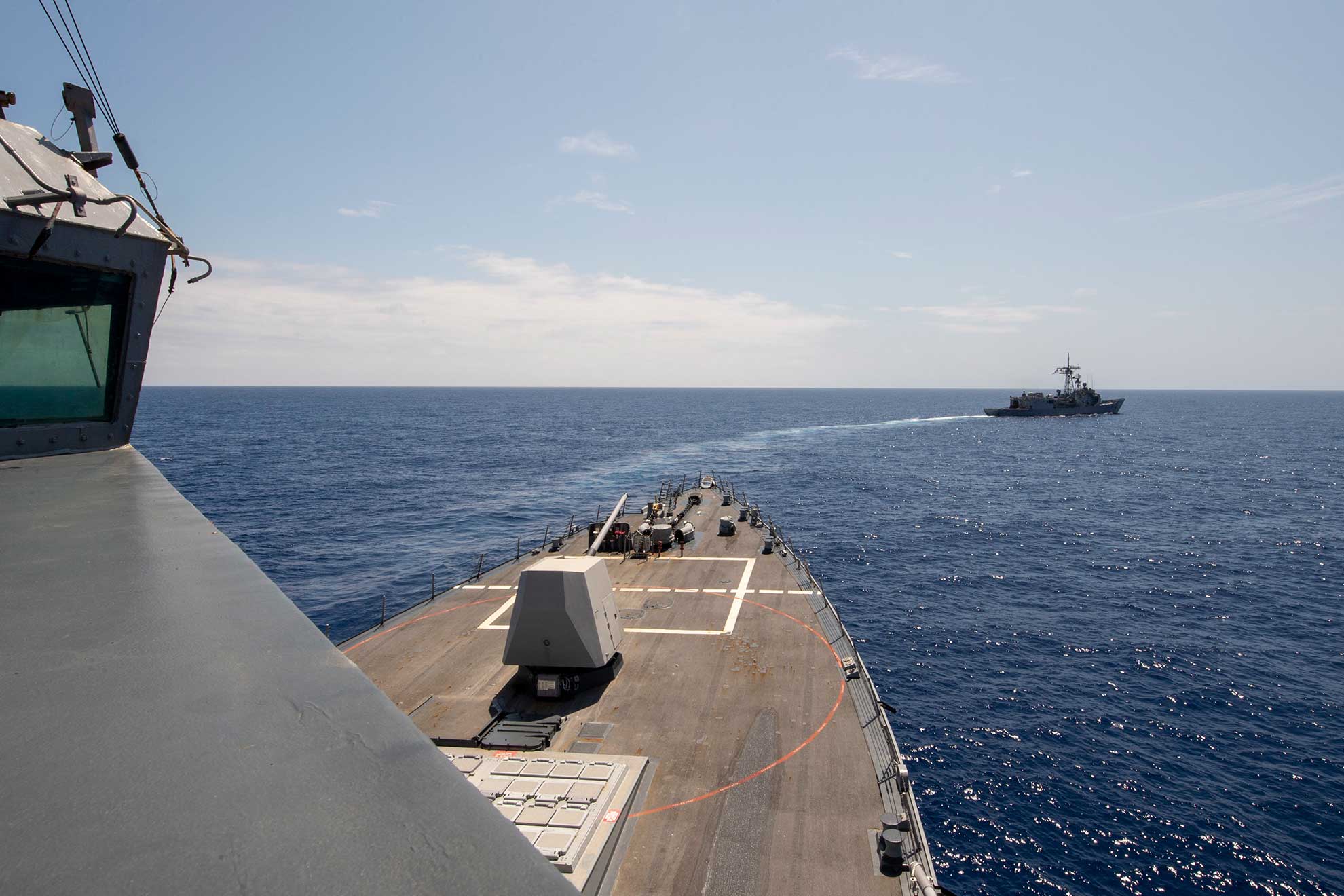 Philippine Sea (April 18, 2019) The Arleigh Burke-class guided-missile destroyer USS Preble (DDG 88) and the Royal Australian Navy Adelaide-class guided-missile frigate HMAS Melbourne (FFG 05) transit in formation during a cooperative deployment. Preble and Melbourne are participating in a cooperative deployment in order to improve on maritime capabilities between partners. Preble is deployed to the U.S 7th Fleet area of operations in support of security and stability in the Indo-Pacific region -- U.S. Navy photo by MCS 1st Class Bryan Niegel. -
