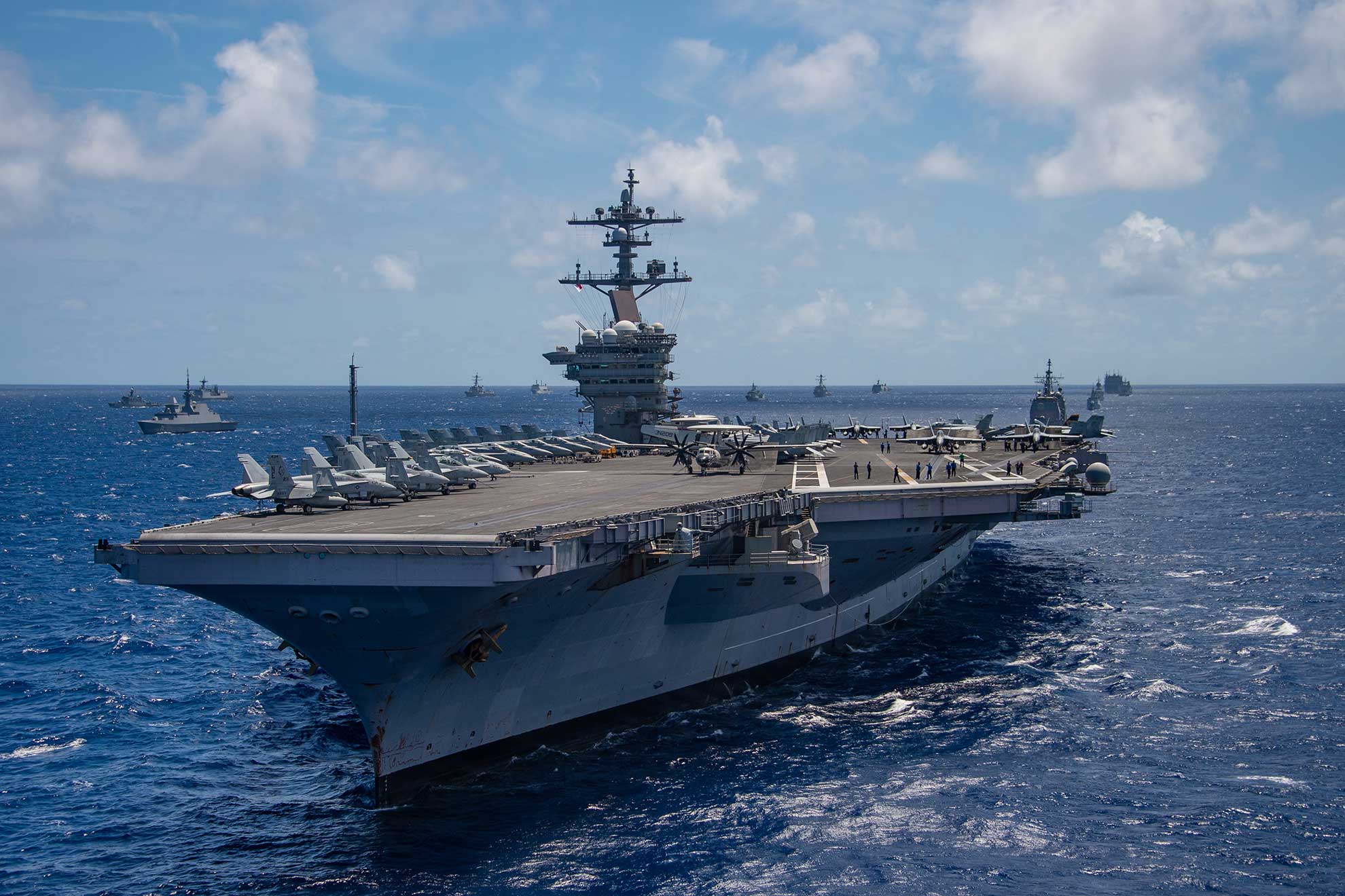 Pacific Ocean (July 26, 2018) The aircraft carrier USS Carl Vinson (CVN 70) participates in a group sail during the Rim of the Pacific (RIMPAC) exercise off the coast of Hawaii, July 26, 2018. Twenty-five nations, 46 ships and five submarines, and about 200 aircraft and 25,000 personnel are participating in RIMPAC from June 27 to Aug. 2 in and around the Hawaiian Islands and Southern California. The world's largest international maritime exercise, RIMPAC provides a unique training opportunity while fostering and sustaining cooperative relationships among participants critical to ensuring the safety of sea lanes and security of the world's oceans. RIMPAC 2018 is the 26th exercise in the series that began in 1971 -- U.S. Navy photo by MCS1 Arthurgwain L. Marquez. -