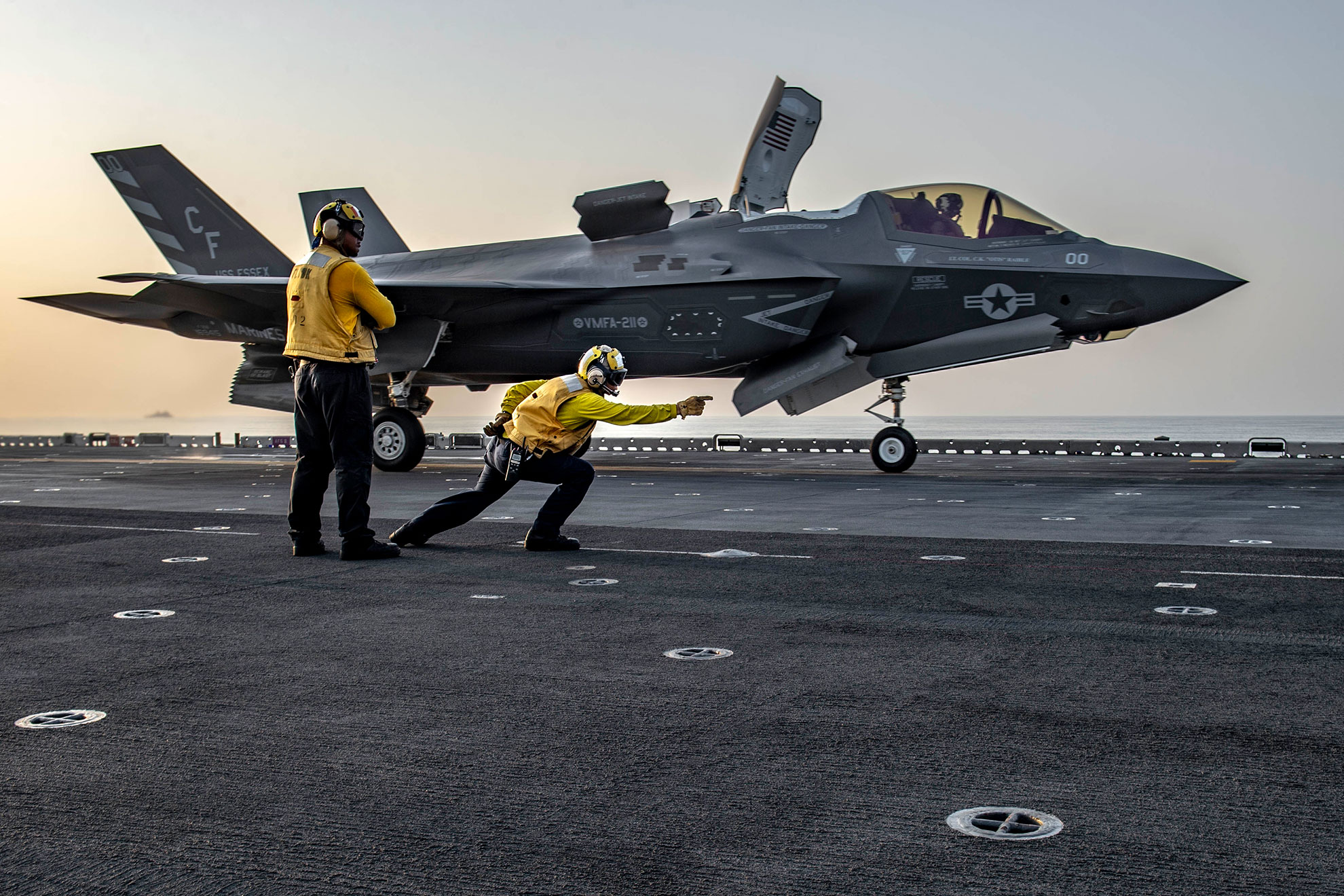 Gulf of Aden (Sept. 7, 2018) Aviation Boatswain's Mate (Handling) 1st Class Francis Centeno launches an F-35B Lightning II attached to the "Avengers" of Marine Fighter Attack Squadron (VMFA) 211 from the flight deck of Wasp-class amphibious assault ship USS Essex (LHD 2). Essex is on a scheduled deployment of the Essex Amphibious Ready Group (ARG) and 13th Marine Expeditionary Unit (MEU). The Essex ARG and 13th MEU is the first U.S. Navy/Marine Corps team to deploy to U.S. 5th Fleet area of operations with the transformational warfighting capabilities of the F-35B Lightning II, making it a more lethal, flexible and persistent force, leading to a more stable region for our partner nations -- U.S. Navy photo by MCS Seaman Sabyn L. Marrs. -