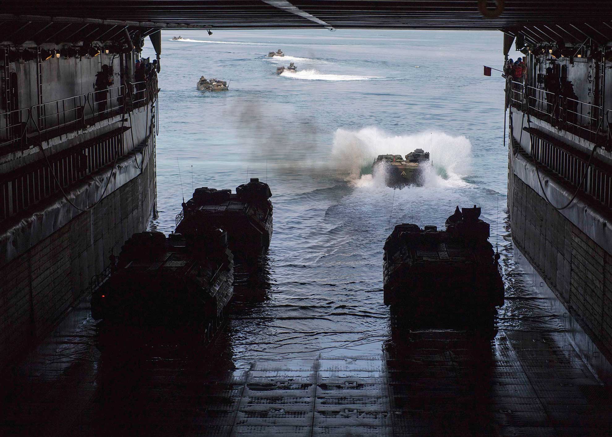 Subic Bay, Republic of the Philippines (Oct. 2, 2018) AAV-P7/A1 assault amphibious vehicles depart the well deck of the amphibious dock landing ship USS Ashland (LSD 48) as part of a training exercise for KAMANDAG 2. KAMANDAG 2 is a military training exercise led by Philippines between the Armed Forces of the Philippines and U.S. military, along with participants from the Japan Self-Defense Force featuring military-to-military exchanges through various training events, capabilities development training, and humanitarian and civic assistance projects. KAMANDAG is an acronym for the Filipino phrase "Kaagapay Ng Mga Mandirigma Ng Dagat," which translates to "Cooperation of Warriors of the Sea," highlighting the partnership between the Philippine and United States Militaries -- U.S. Navy photo by MCS2 Joshua Mortensen. -