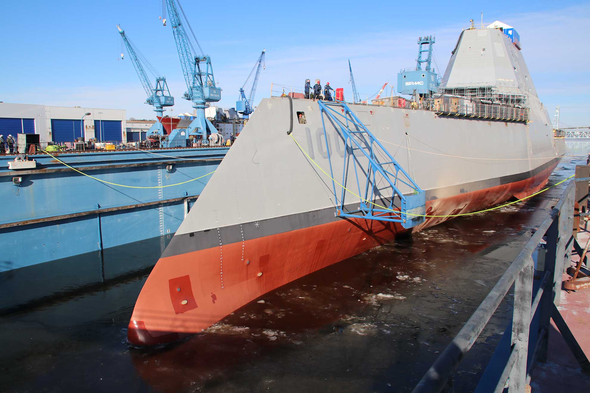 Bath, Maine Maine (Dec. 9, 2018) Following a multi-day process that includes moving the ship from the land level facility to the dry dock, the future USS Lyndon B. Johnson (DDG 1002) is made ready before flooding of the dry dock at General Dynamic-Bath Iron Works shipyard, and subsequent launching of the third Zumwalt-class destroyer -- U.S. Navy photo courtesy of General Dynamics-Bath Iron Works. -