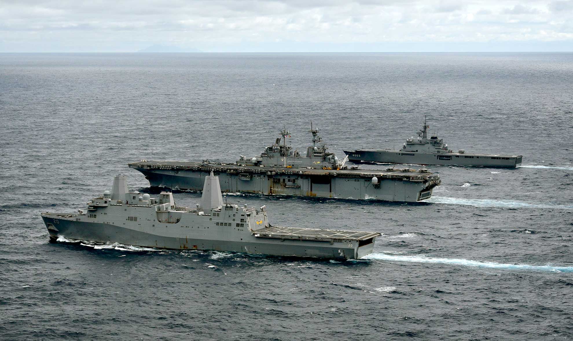 East China sea (Jan. 12, 2019) The amphibious transport dock ship USS Green Bay (LPD 20), left, amphibious assault ship USS Wasp (LHD 1), and Japan Maritime Self-Defense Force amphibious transport dock ship JS Kunisaki (LST 4003) transit in formation during a cooperative deployment. Wasp, flagship of Wasp Amphibious Ready Group, is operating in the Indo-Pacific region to enhance interoperability with partners and serve as a ready-response force for any type of contingency -- U.S. Navy photo by MCS1 Daniel Barker. -