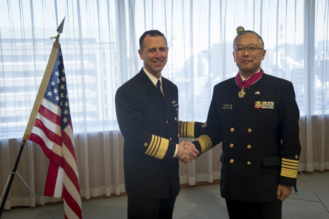 Tokyo, Japan (Jan. 18, 2019) Chief of Naval Operations (CNO) Adm. John Richardson, left, presents Adm. Yutaka Murakawa, chief of maritime staff of the Japan Maritime Self-Defense Force (JMSDF), with the Legion of Merit on behalf of the secretary of defense. The U.S. Navy and the JMSDF routinely conduct combined maritime exercises and operate together to promote peace and security in the Indo-Pacific region -- U.S. Navy photo by Chief MCS Elliott Fabrizio. -