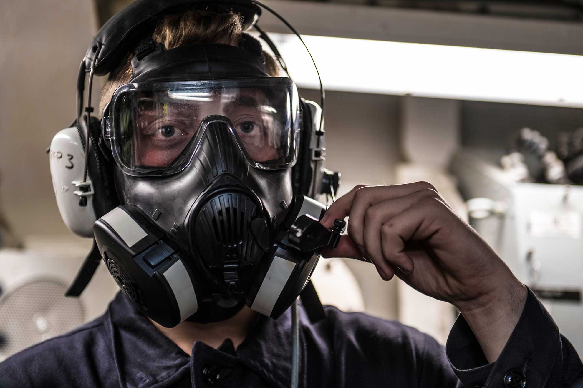 Plymouth, England (Feb. 8, 2019) Logistics Specialist 3rd Class Collin Schwab acts as phone talker during a chemical, biological, and radiological drill aboard the Arleigh Burke-class guided-missile destroyer USS Porter (DDG 78) in Plymouth, England, Feb. 8, 2019. Porter, forward-deployed to Rota, Spain, is on its sixth patrol in the U.S. 6th Fleet area of operations in support of U.S national security interests in Europe and Africa -- U.S. Navy photo by MCS2 James R. Turner. -