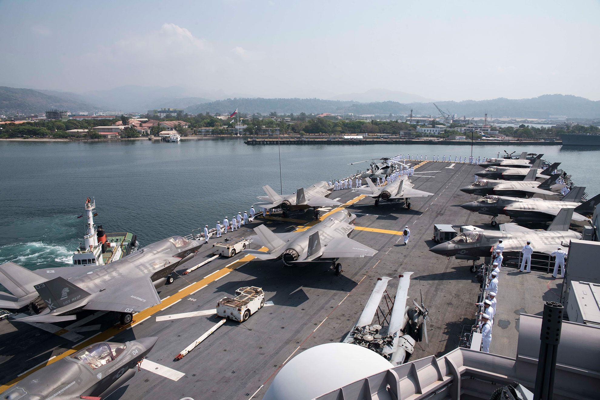 Subic Bay, Philippines (March 30, 2019) Sailors aboard the amphibious assault ship USS Wasp (LHD 1) man the rails while arriving in Subic Bay for Exercise Balikatan. Exercise Balikatan, in its 35th iteration, is an annual U.S., Philippine military training exercise focused on a variety of missions, including humanitarian assistance and disaster relief, counter-terrorism, and other combined military operations -- U.S. Navy photo by MCS Specialist 3rd Class Benjamin F. Davella III. -