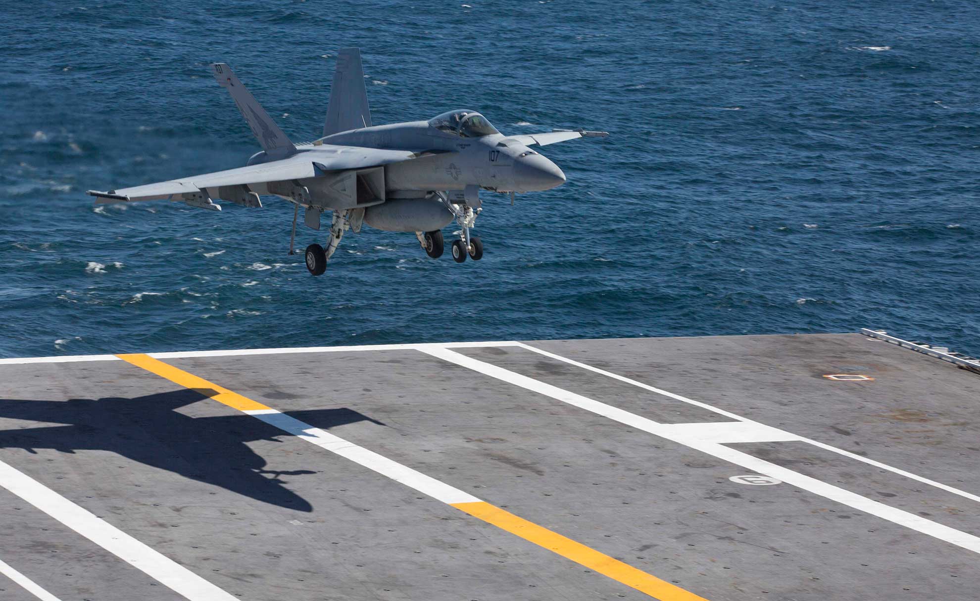 Atlantic Ocean (April 3, 2019) An F/A-18E Super Hornet from the "'Pukin' Dogs" of Strike Fighter Squadron (VFA) 143 prepares to make an arrested landing on the flight deck of the Nimitz-class aircraft carrier USS Abraham Lincoln (CVN 72. Abraham Lincoln is underway as part of the Abraham Lincoln Carrier Strike Group deployment in support of maritime security cooperation efforts in the U.S. 5th, 6th and 7th Fleet areas of responsibility. With Abraham Lincoln as the flagship, deployed strike group assets include staffs, ships and aircraft of Carrier Strike Group (CSG) 12, Destroyer Squadron (DESRON) 2, the guided-missile cruiser USS Leyte Gulf (CG 55) and Carrier Air Wing (CVW) 7; as well as the Spanish navy Alvaro de Bazan-class frigate ESPS Mendez Nuñez (F 104) -- U.S. Navy photo by MCS Seaman Tristan Kyle Labuguen. -