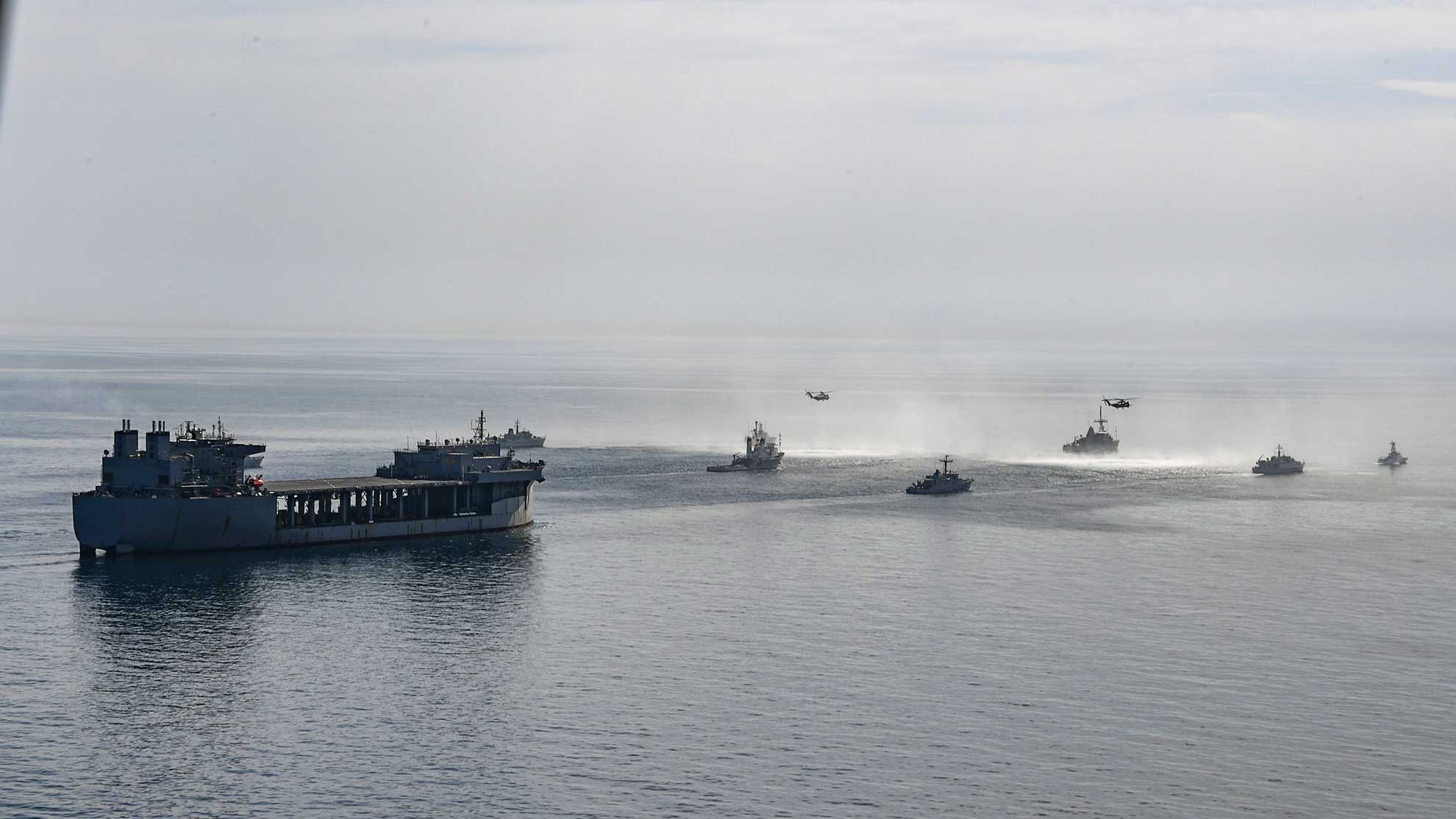 Arabian Gulf (April 10, 2019) The U.S. Navy expeditionary sea base USS Lewis B. Puller (ESB 3), fleet ocean tug USNS Catawba (T-ATF 168), Avenger-class mine countermeasures ship USS Sentry (MCM 3), U.S. Coast Guard Island-class coastal patrol boats USCGC Maui (WPB 1304) and USCGC Wrangell (WPB 1332); the Royal Navy landing ship dock RFA Cardigan Bay (L3009); the French Marine Nationale minehunters FS L'Aigle (M647) and FS Sagittaire (M650); the Royal Navy minehunters HMS Shoreham (M112) and HMS Ledbury (M30); and Mine Countermeasures Squadron (HM) 15 MH-53E Sea Dragon helicopters navigate the Arabian Gulf in formation during Artemis Trident 19. Artemis Trident is a mine countermeasures exercise conducted by France's Marine Nationale, the Royal Navy and the U.S. Navy in the Arabian Gulf focused on increasing interoperability and demonstrating the nations' shared commitment to ensuring unfettered maritime operations -- U.S. Navy photo by MCS 2nd Class Samantha P. Montenegro. -