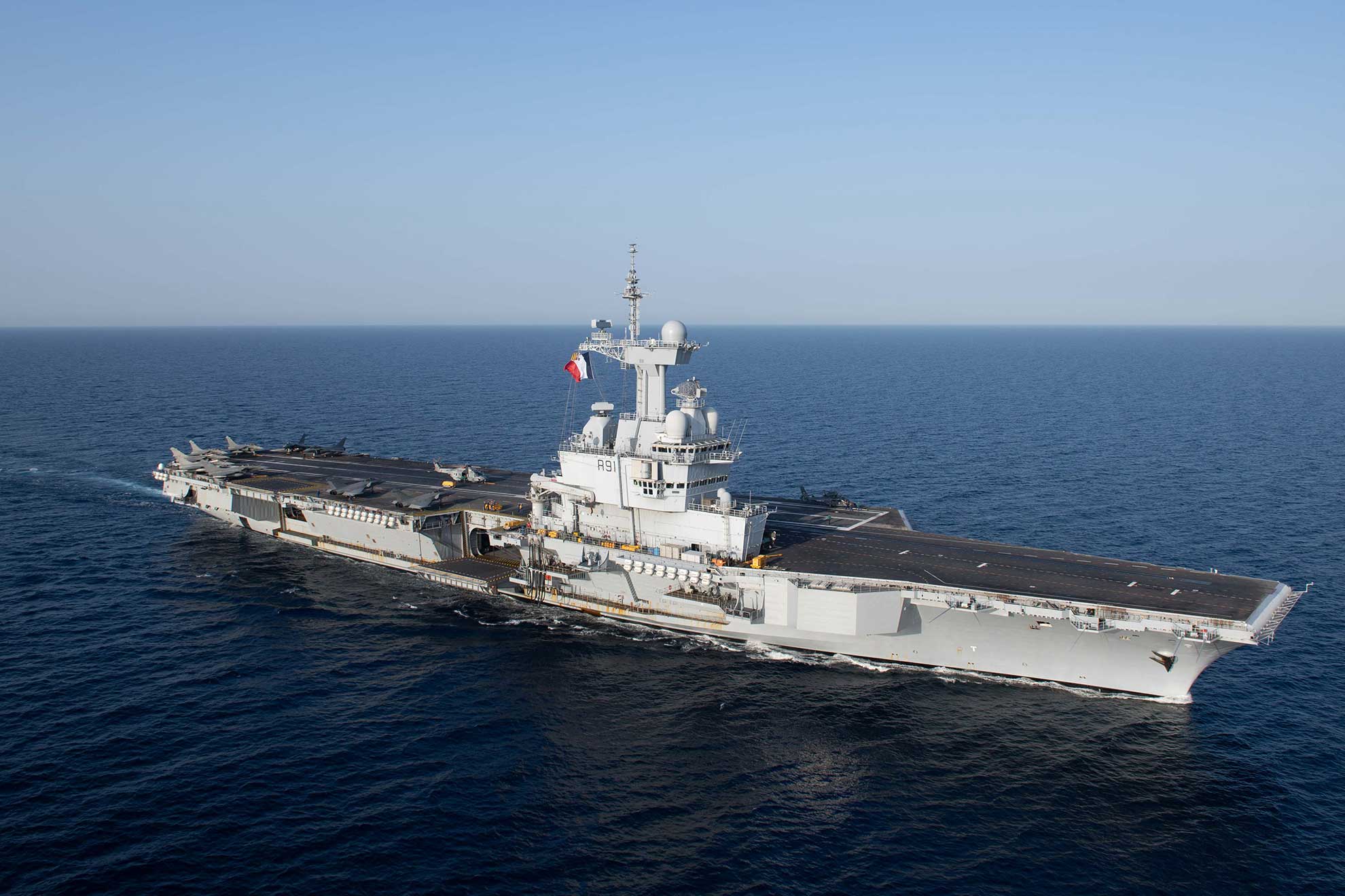 Red Sea (April 15, 2019) The French Marine Nationale aircraft carrier FS Charles De Gaulle (R91) transits the Red Sea, April 15, 2019. The John C. Stennis Carrier Strike Group is deployed to the U.S. 5th Fleet area of operations in support of naval operations to ensure maritime stability and security in the Central Region, connecting the Mediterranean and the Pacific through the western Indian Ocean and three strategic choke points -- U.S. Navy photo by MCS Seaman Joshua L. Leonard. -