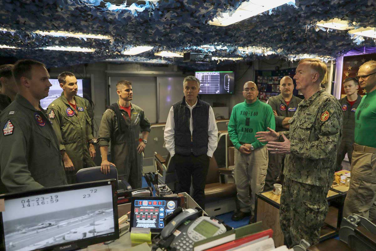Mediterrannean Sea (April 22, 2019) Adm. James G. Foggo III, right, commander of U.S. Naval Forces Europe-Africa and commander, Allied Joint Force Command Naples, Italy, and U.S. Ambassador to Russia Jon M. Huntsman Jr., center, meet with Sailors assigned to the "Patriots" of Electronic Attack Squadron (VAQ) 140 aboard the aircraft carrier USS Abraham Lincoln (CVN 72). Huntsman is meeting with U.S. Navy leadership to discuss the maritime environment in Europe. Abraham Lincoln is underway as part of the Abraham Lincoln Carrier Strike Group deployment in support of maritime security cooperation efforts in the U.S. 5th, 6th and 7th Fleet areas of responsibility. With Abraham Lincoln as the flagship, deployed strike group assets include staffs, ships and aircraft of Carrier Strike Group (CSG) 12, Destroyer Squadron (DESRON) 2, the guided-missile cruiser USS Leyte Gulf (CG 55) and Carrier Air Wing (CVW) 7; as well as the Spanish navy Alvaro de Bazan-class frigate ESPS Mendez Nuñez (F 104) -- U.S. Navy photo -